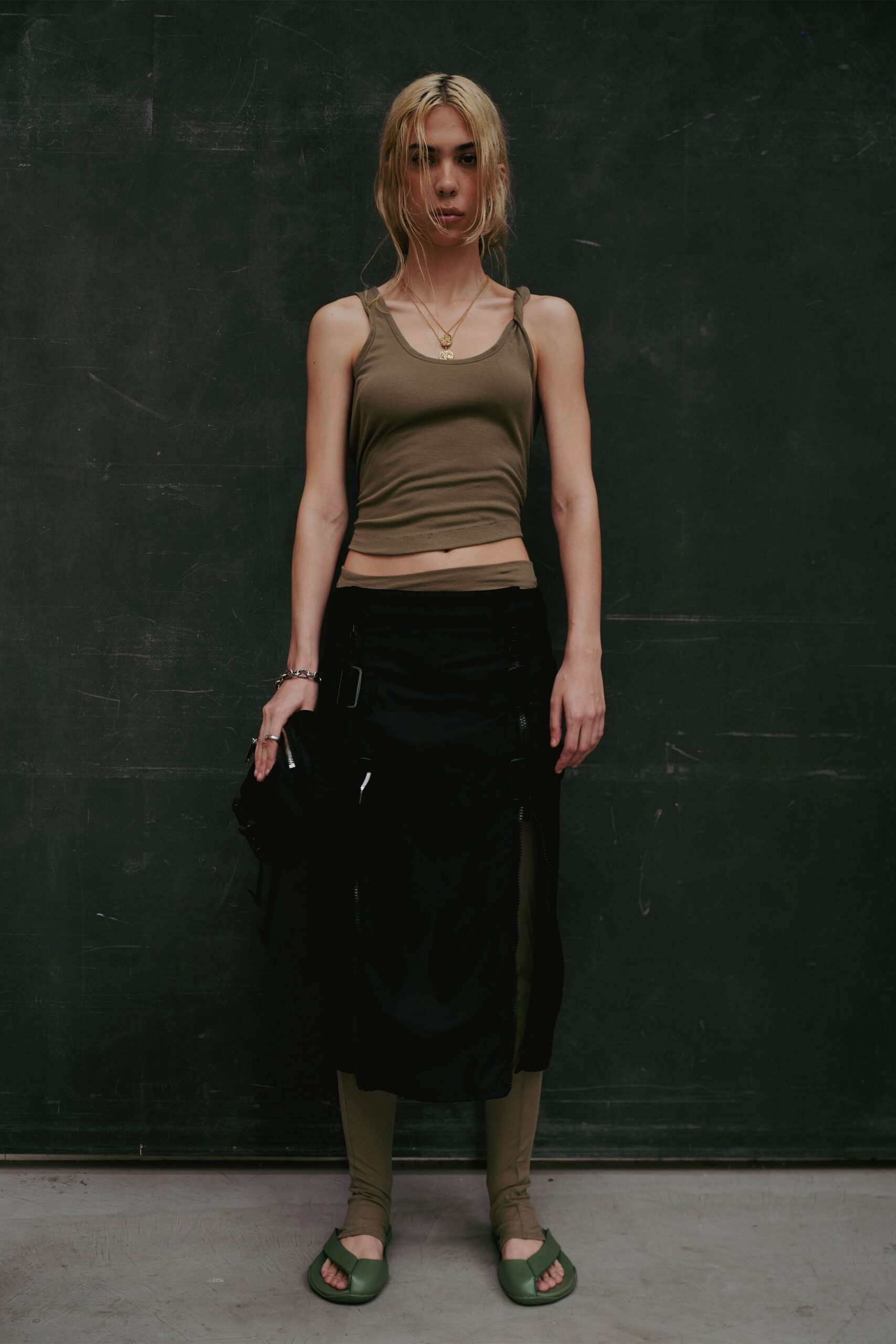 olive tank-top black skirt