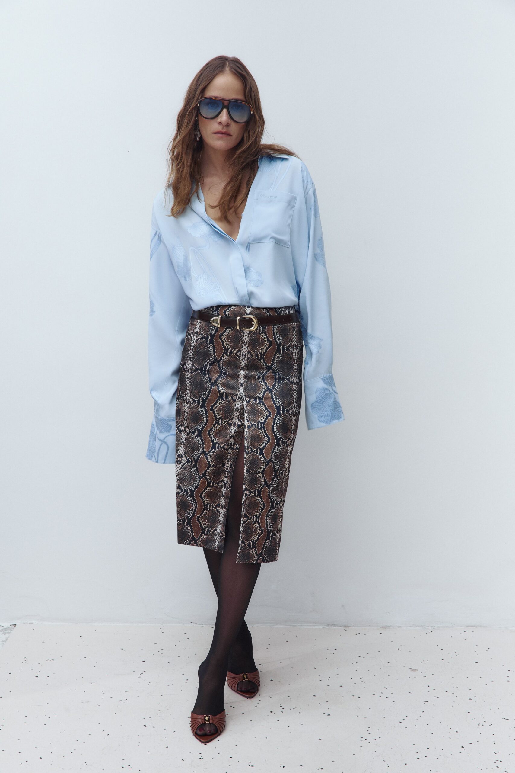 blue silk shirt with animal-print skirt