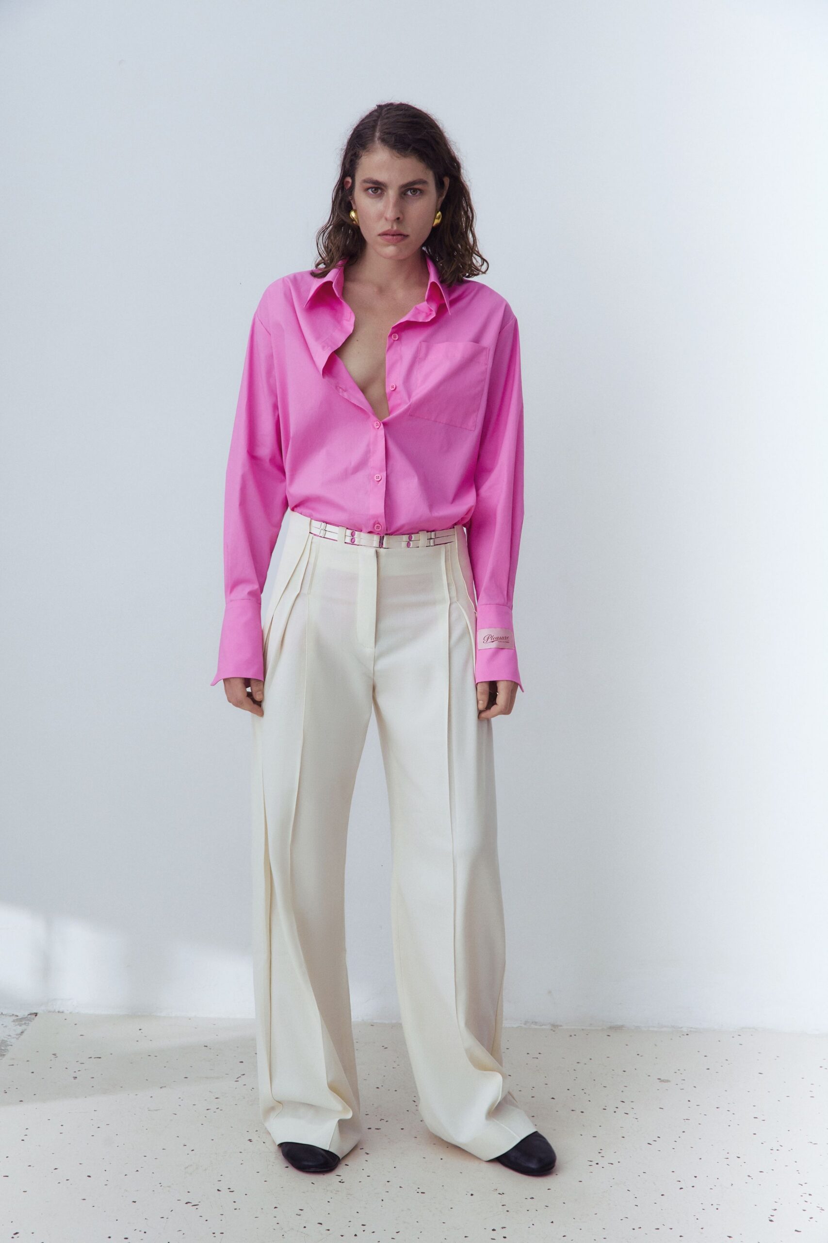 pink shirt white tailored pants