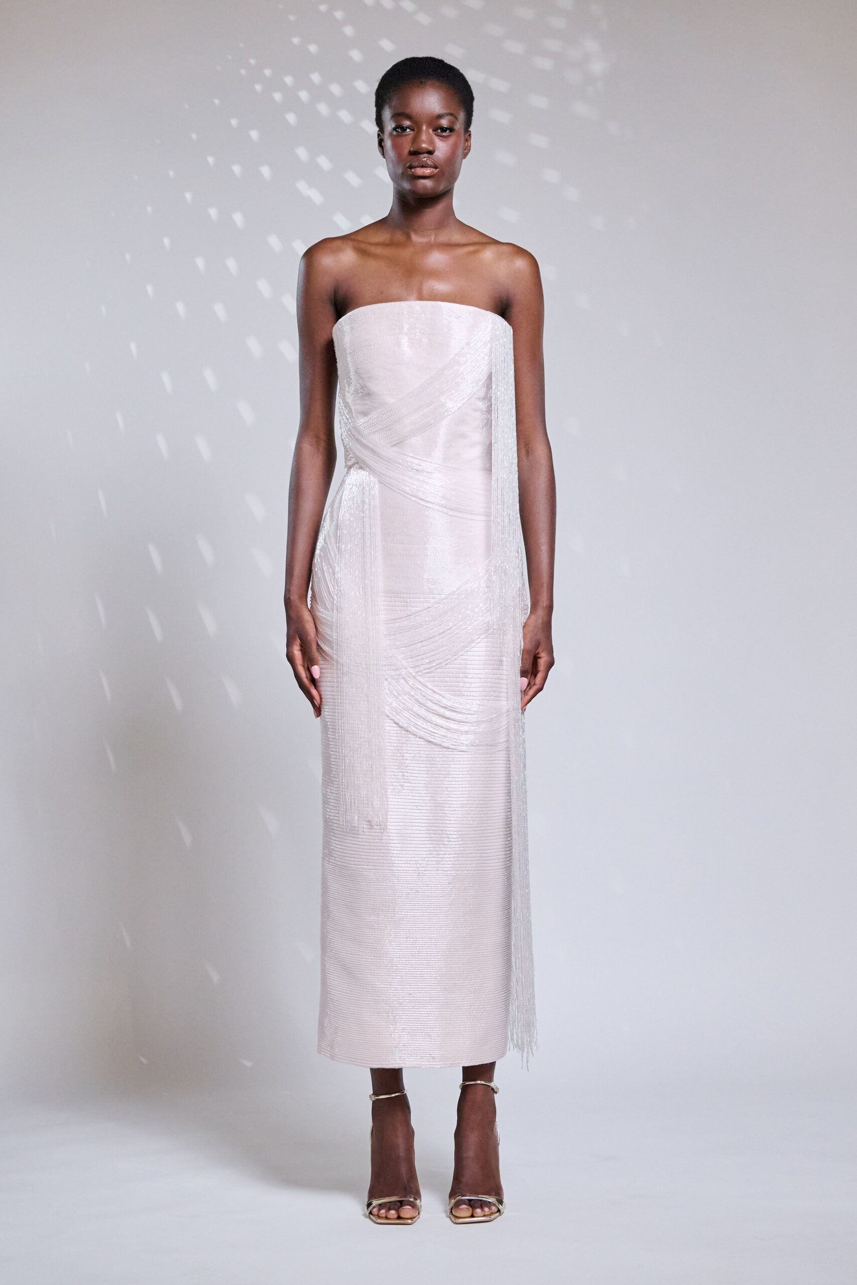 pink silk strapless fitted fringed draped shiny gown