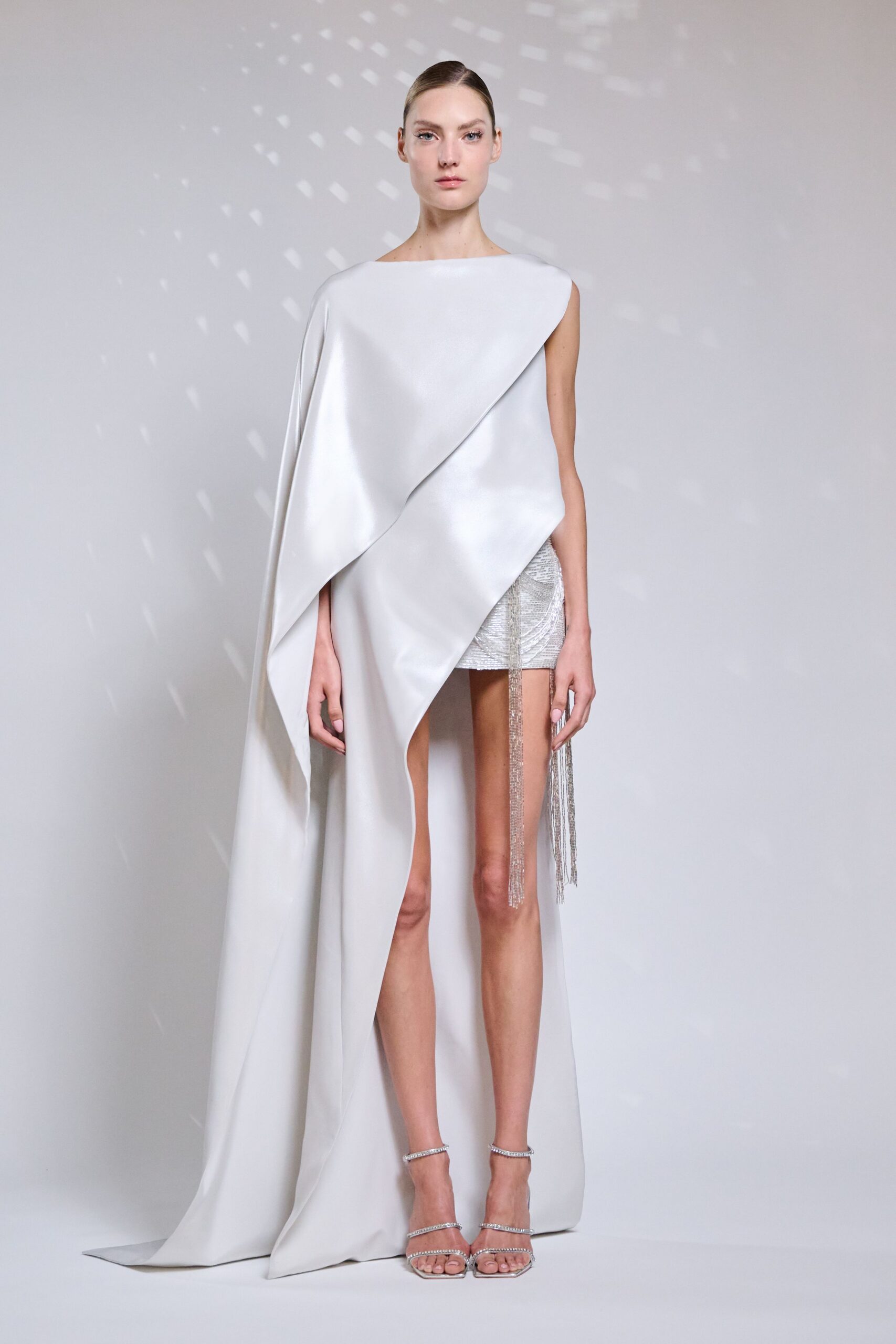white silk sleeveless high-neck fitted draped flowing dress
