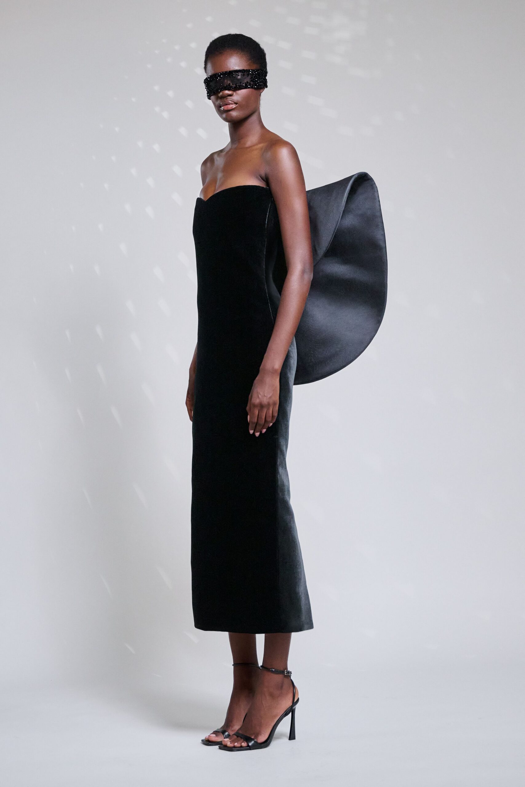 black velvet strapless fitted draped maxi gown
