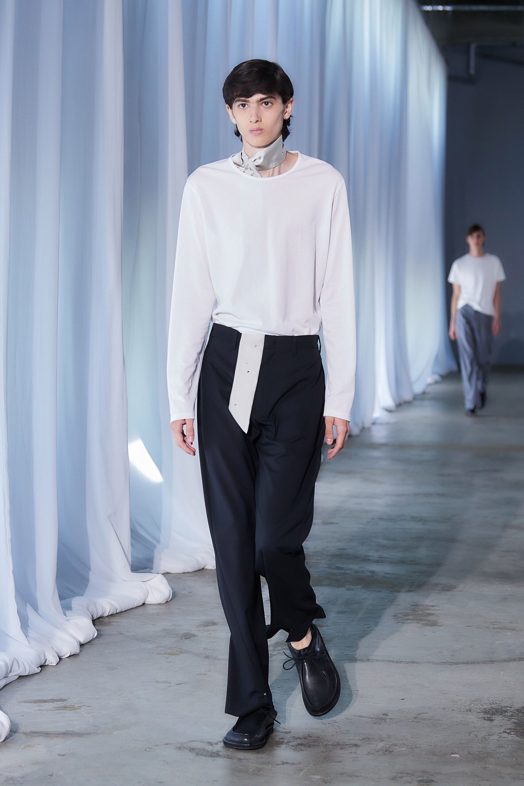 white relaxed shirt with black pants