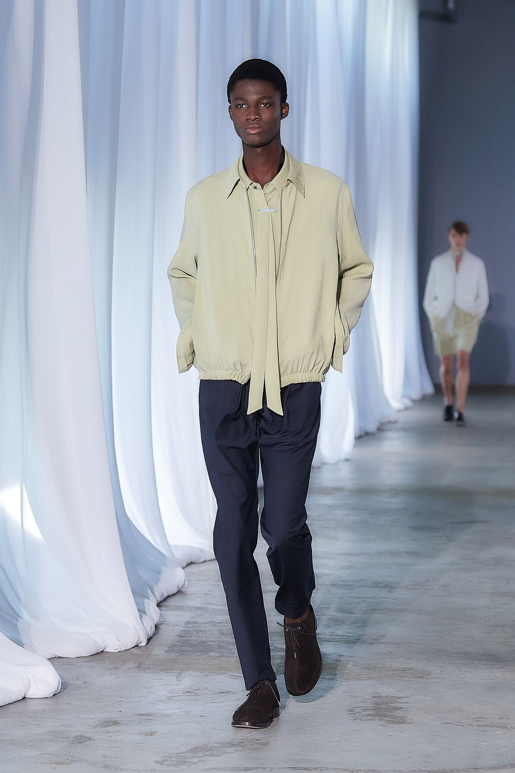light green relaxed jacket with navy pants