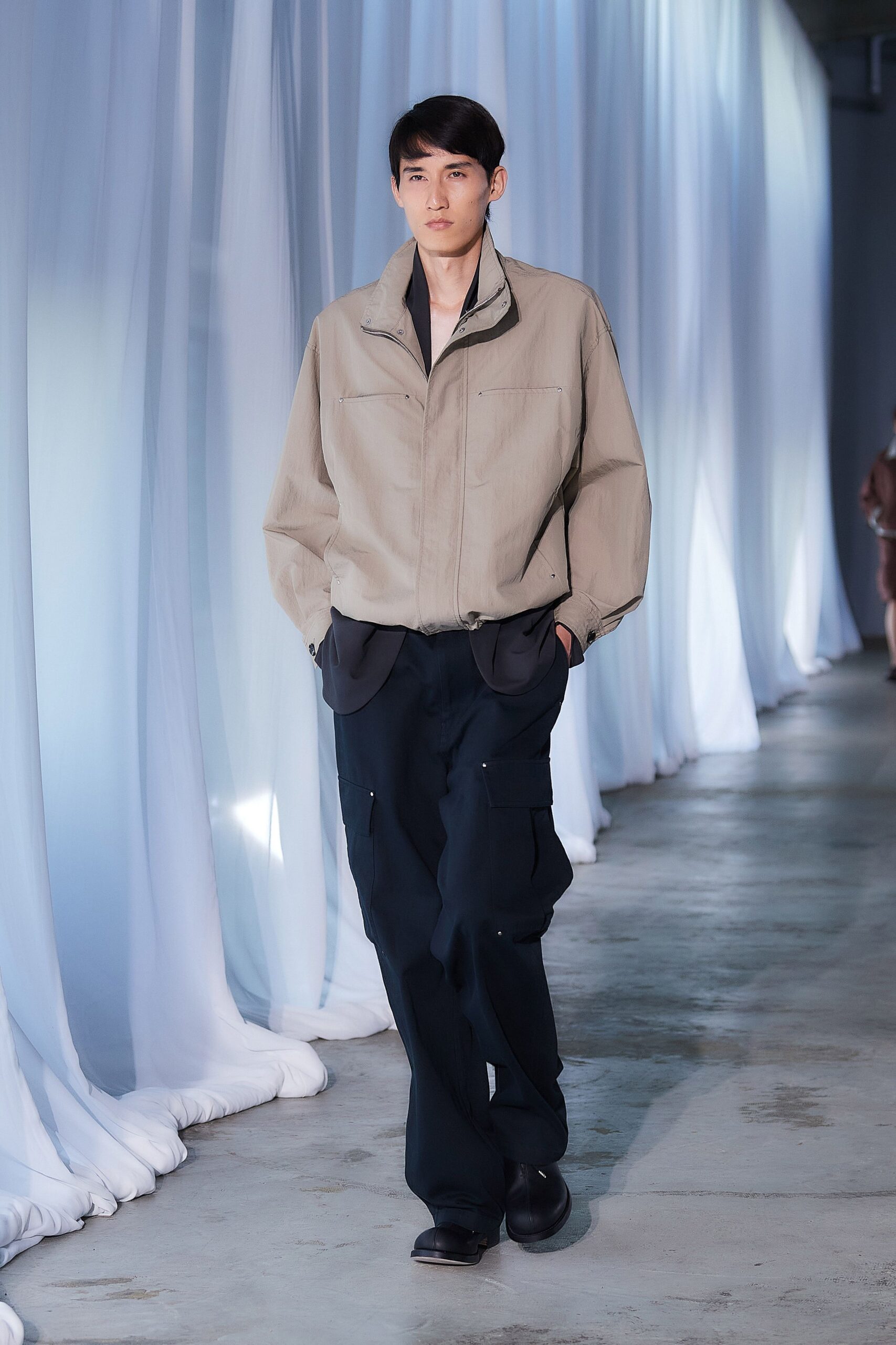 beige relaxed jacket with navy cargo pants