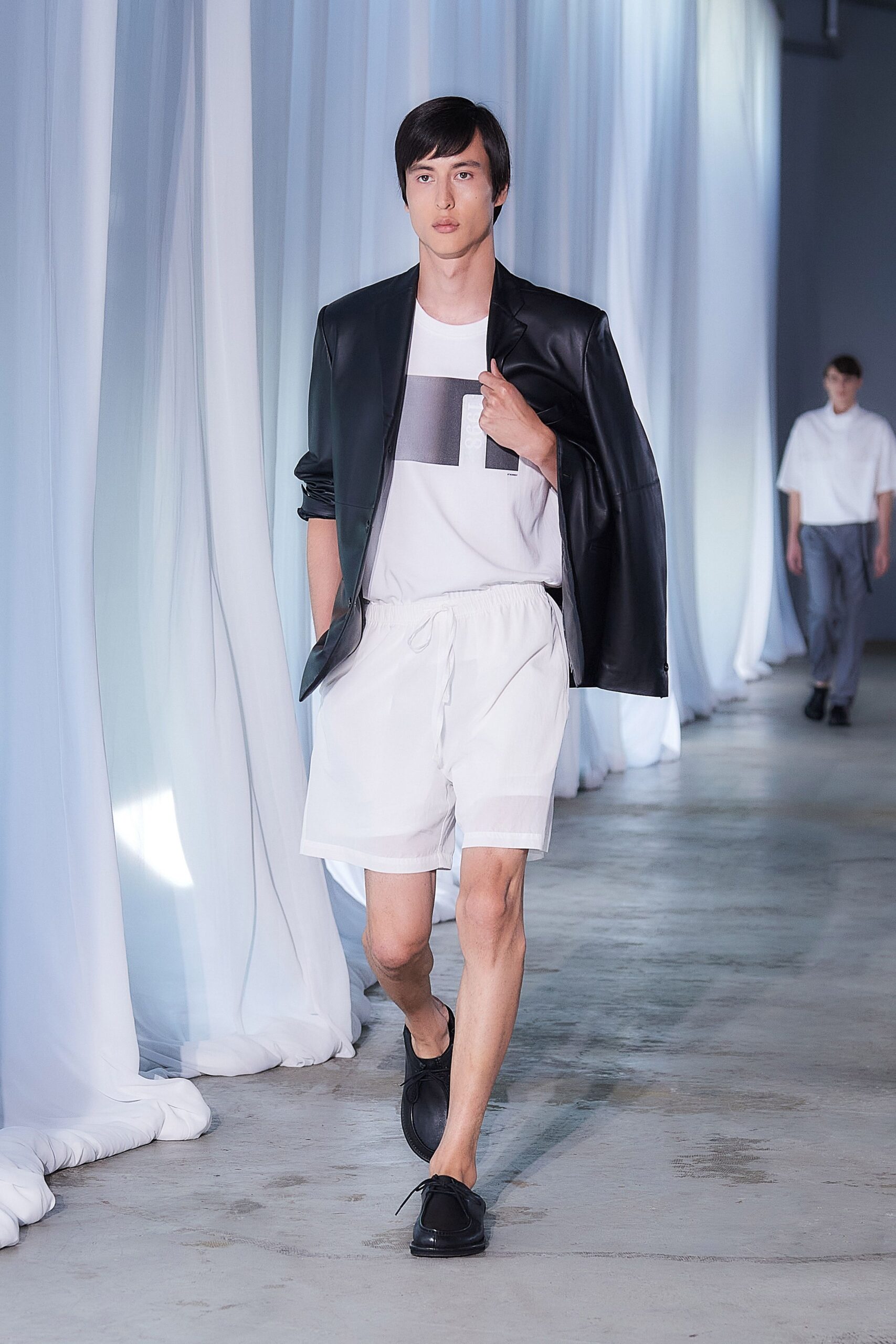 black leather blazer with white t-shirt and shorts