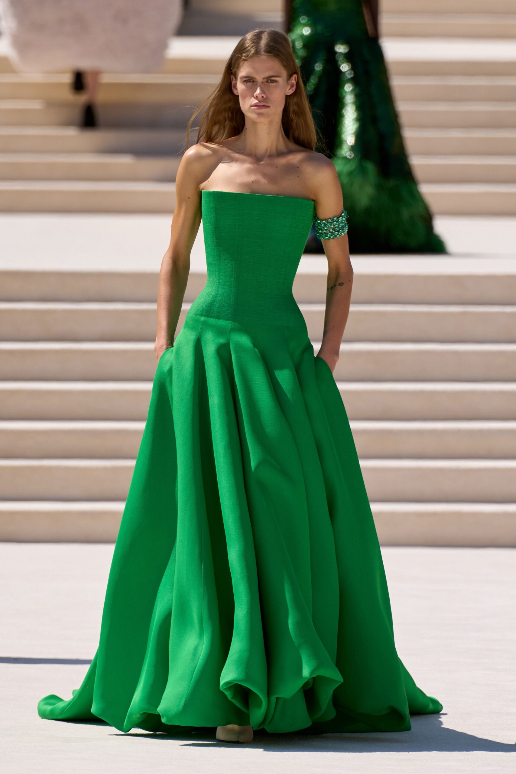 green strapless pleated gown