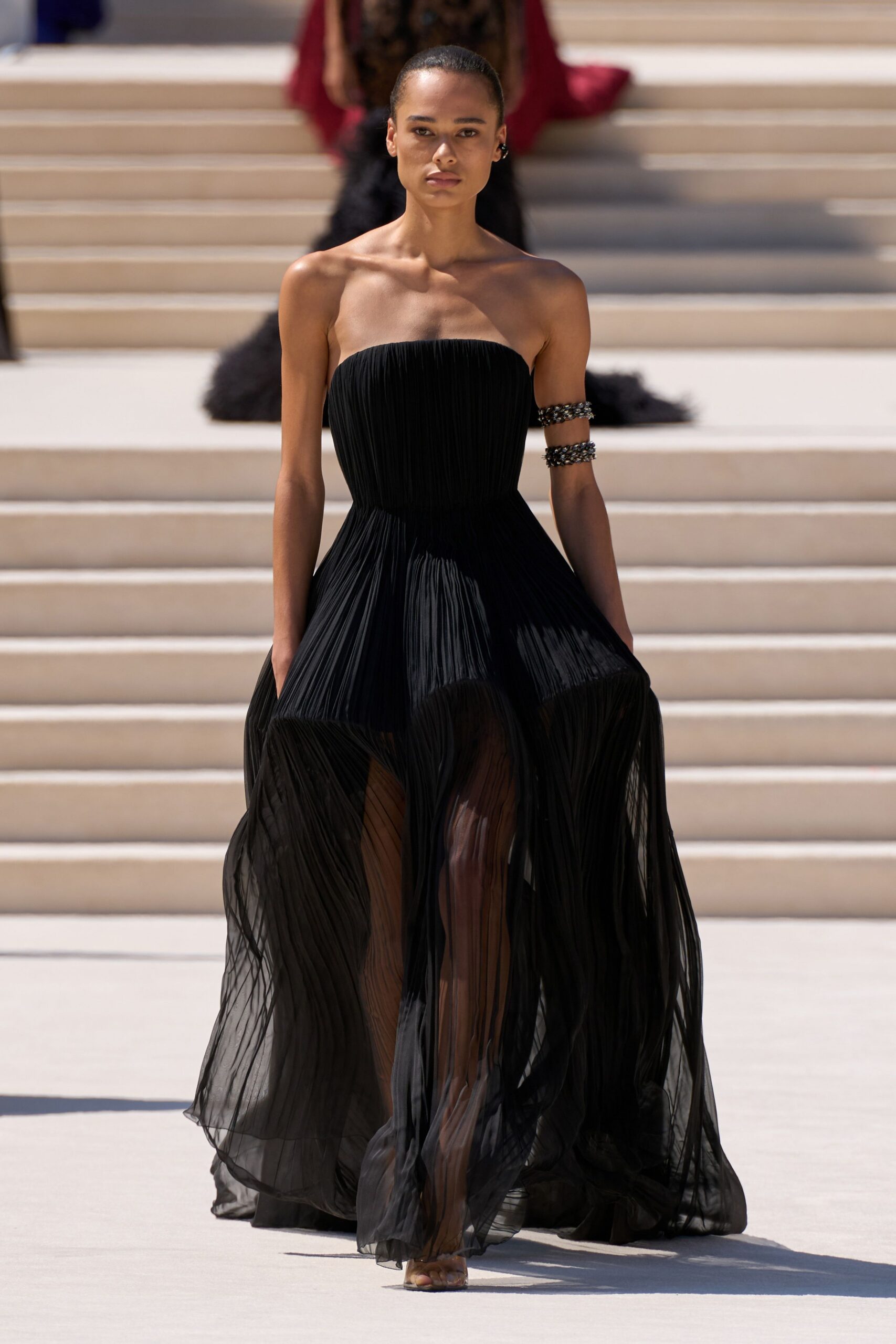 black pleated strapless gown