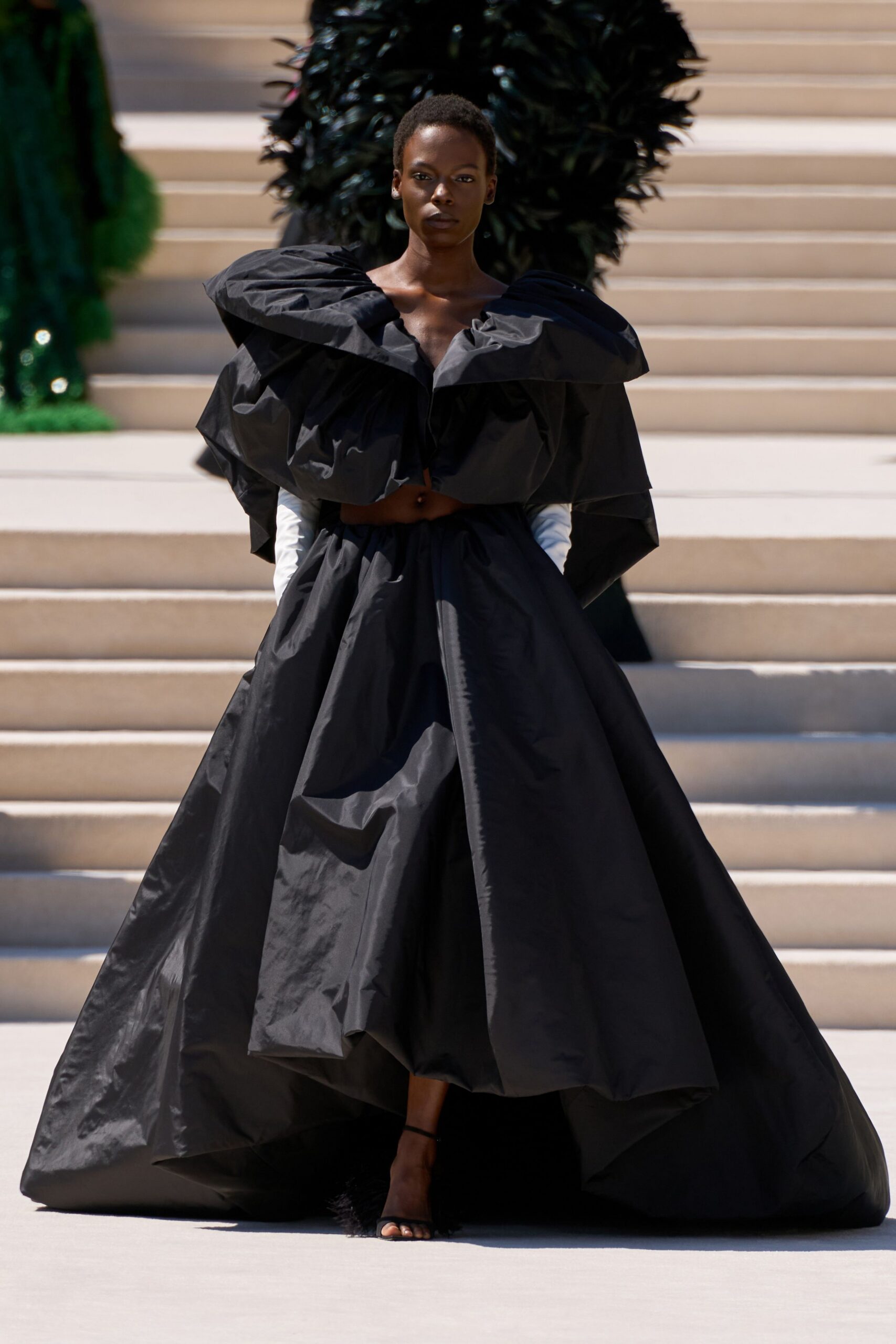 black cotton sleeveless v-neck fitted layered pleated gown