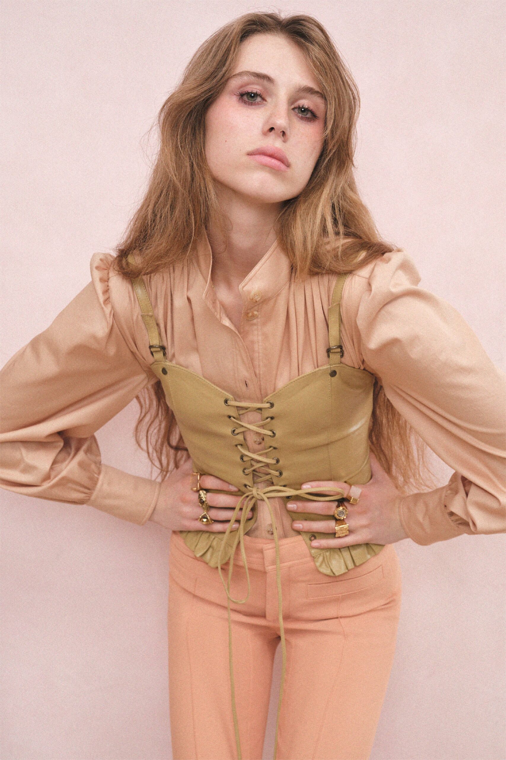 beige shirt green corset pink pants