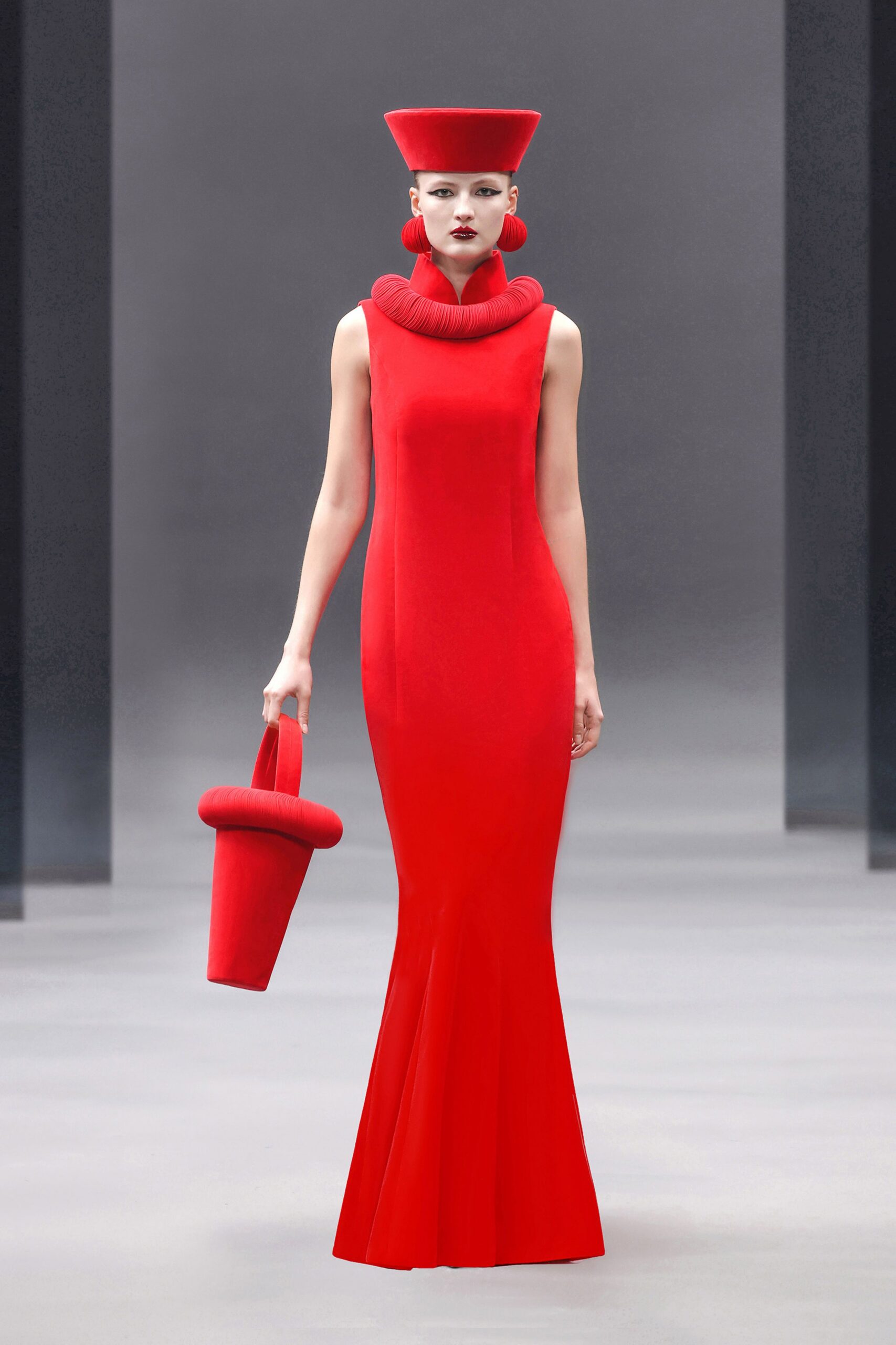 red fitted gown with hat and bag