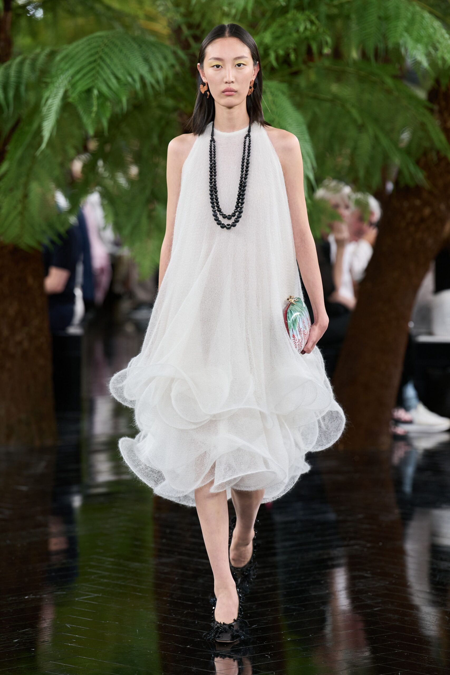 white tulle sleeveless high-neck fitted tiered flowing dress