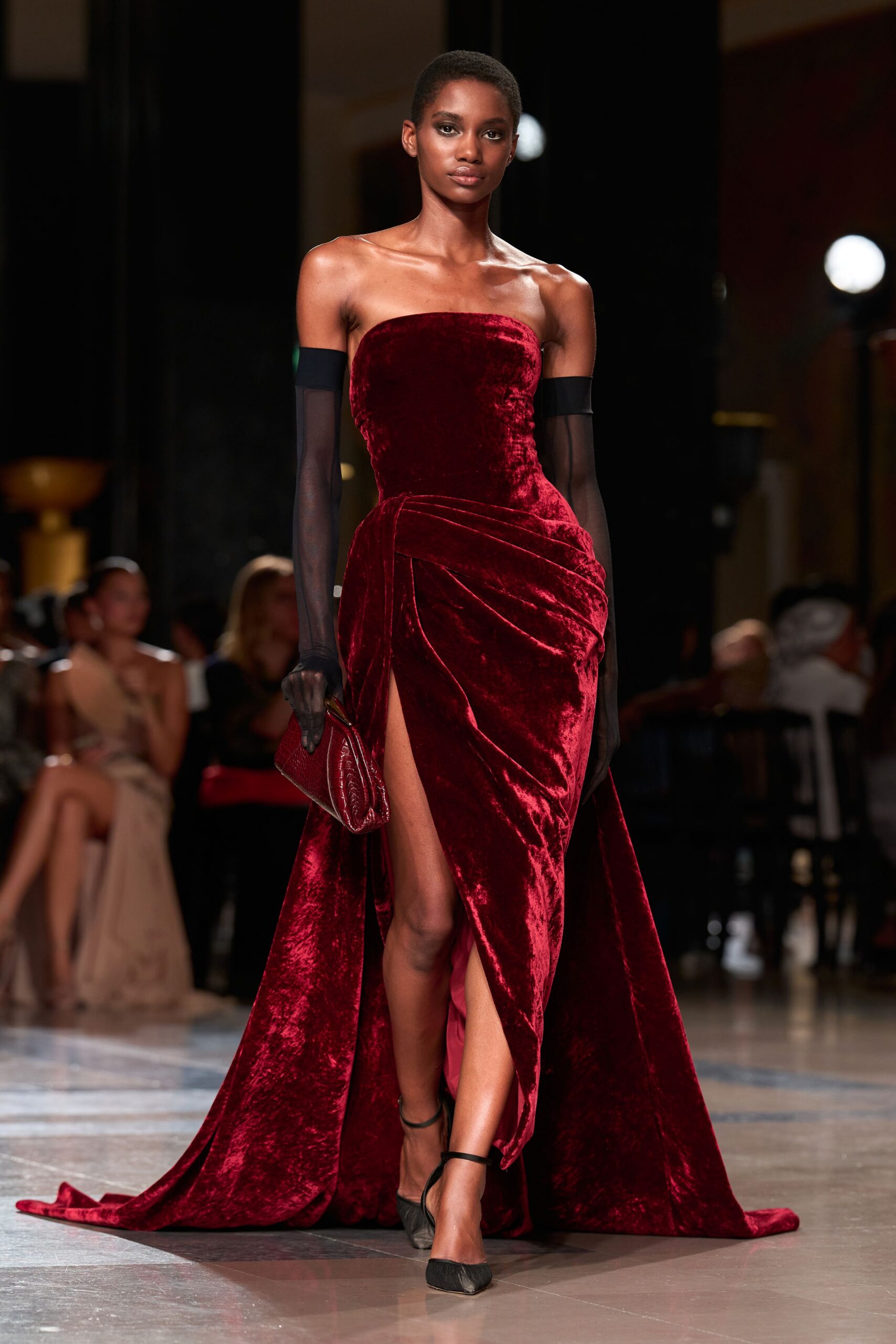 red velvet strapless slit fitted ruched flowing gown