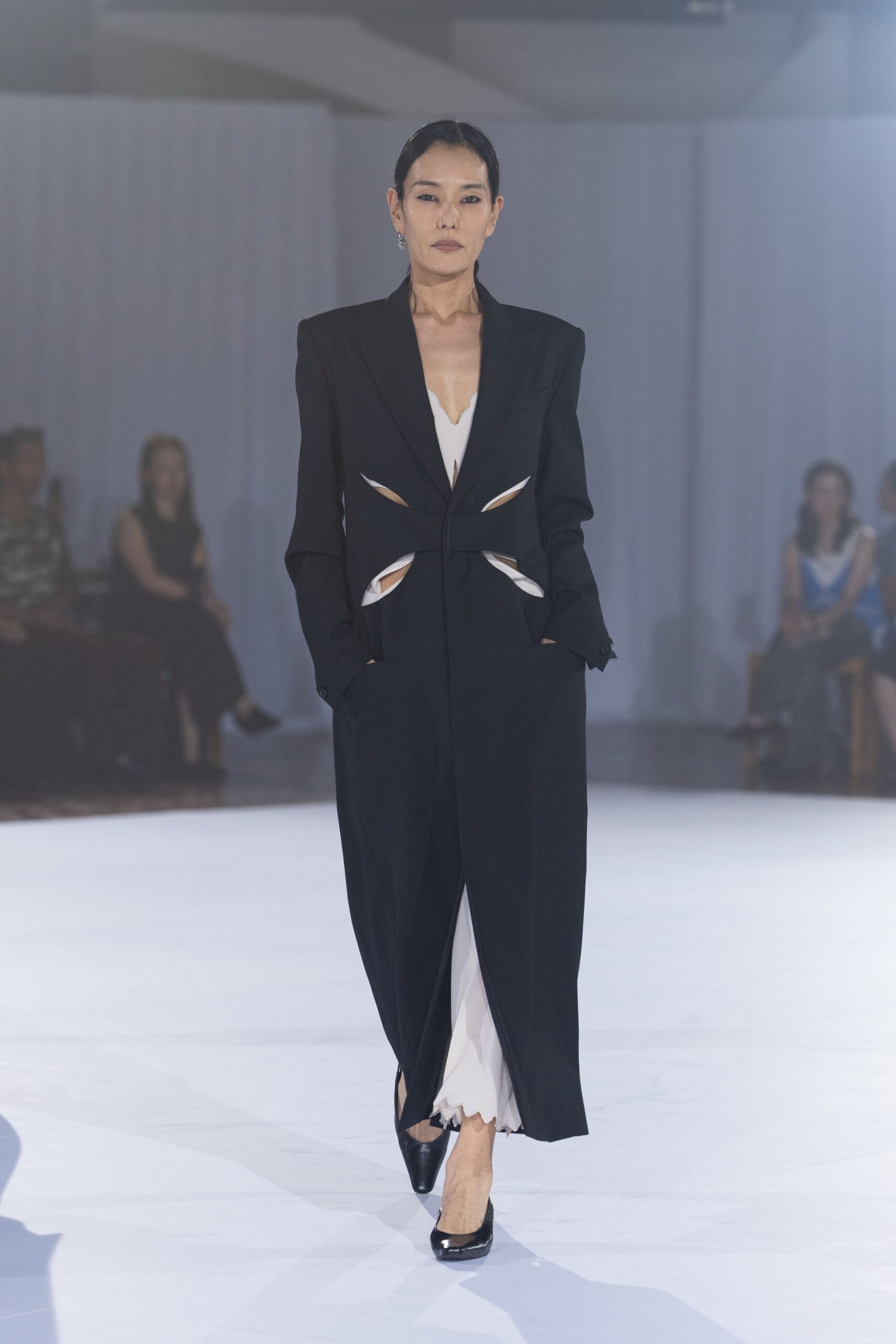 black cotton long-sleeve collared structured buttoned coat