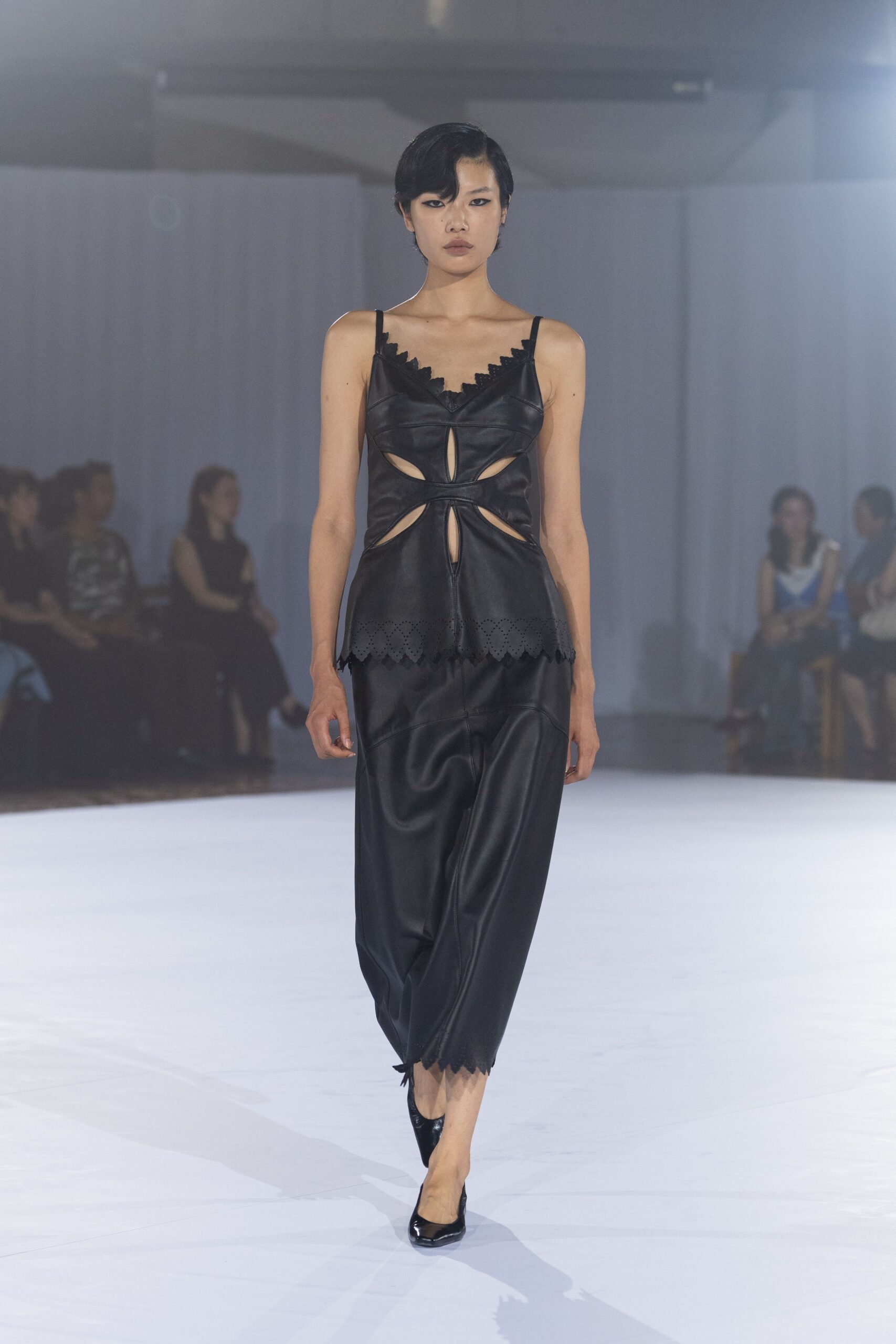 black leather sleeveless v-neck fitted ruffled top