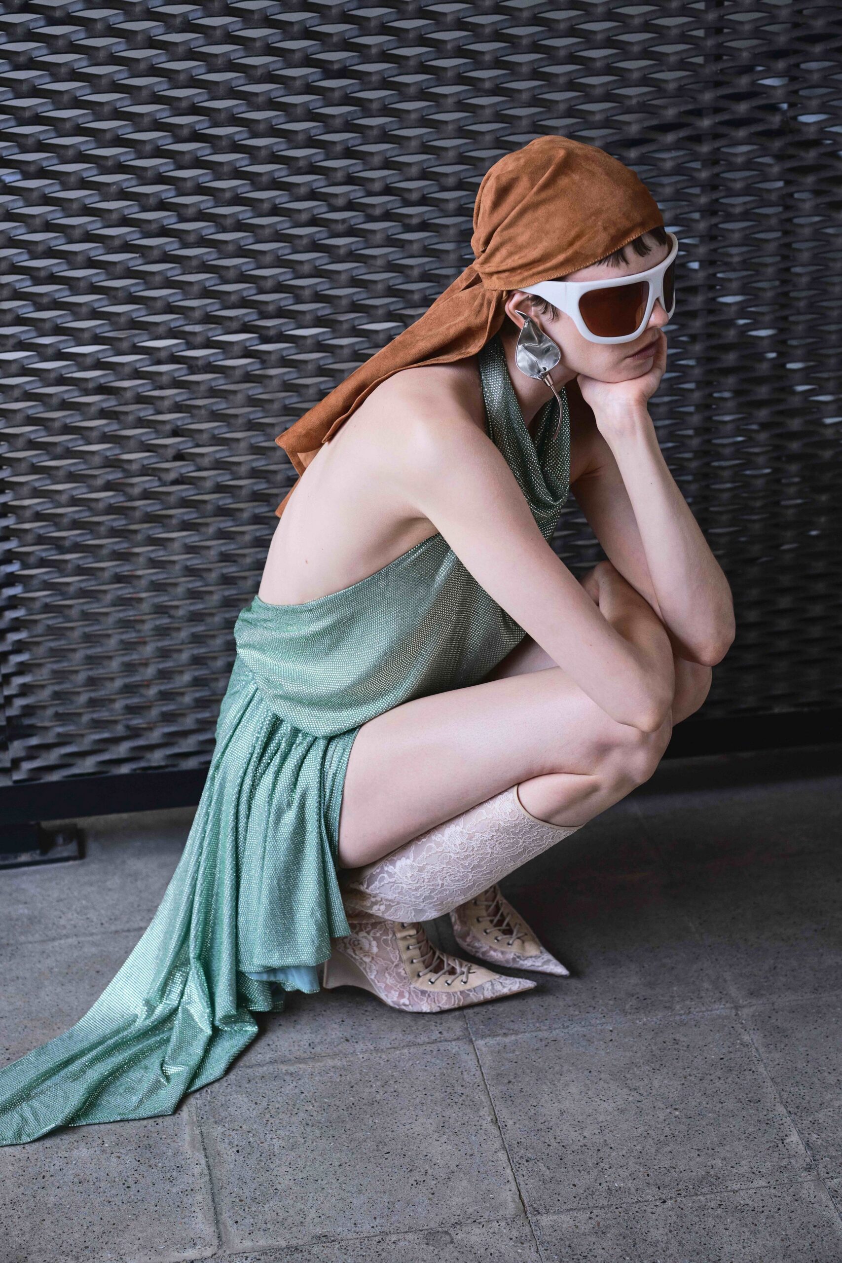 green draped midi dress with accessories