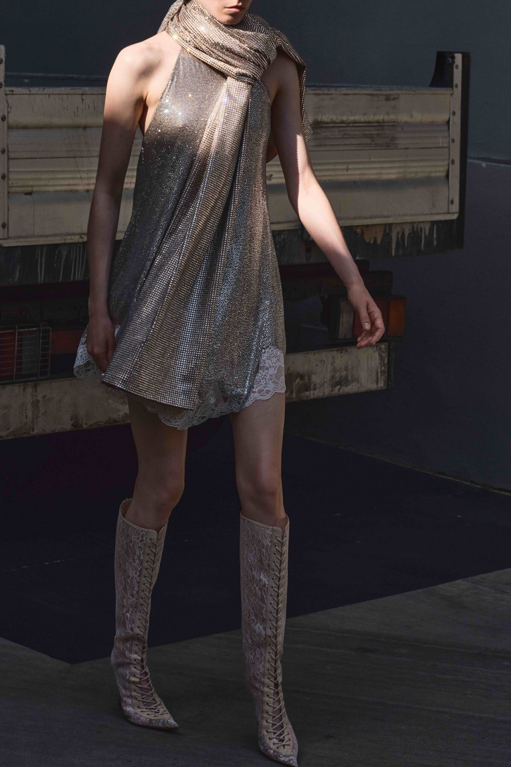 silver halter mini dress with beige boots
