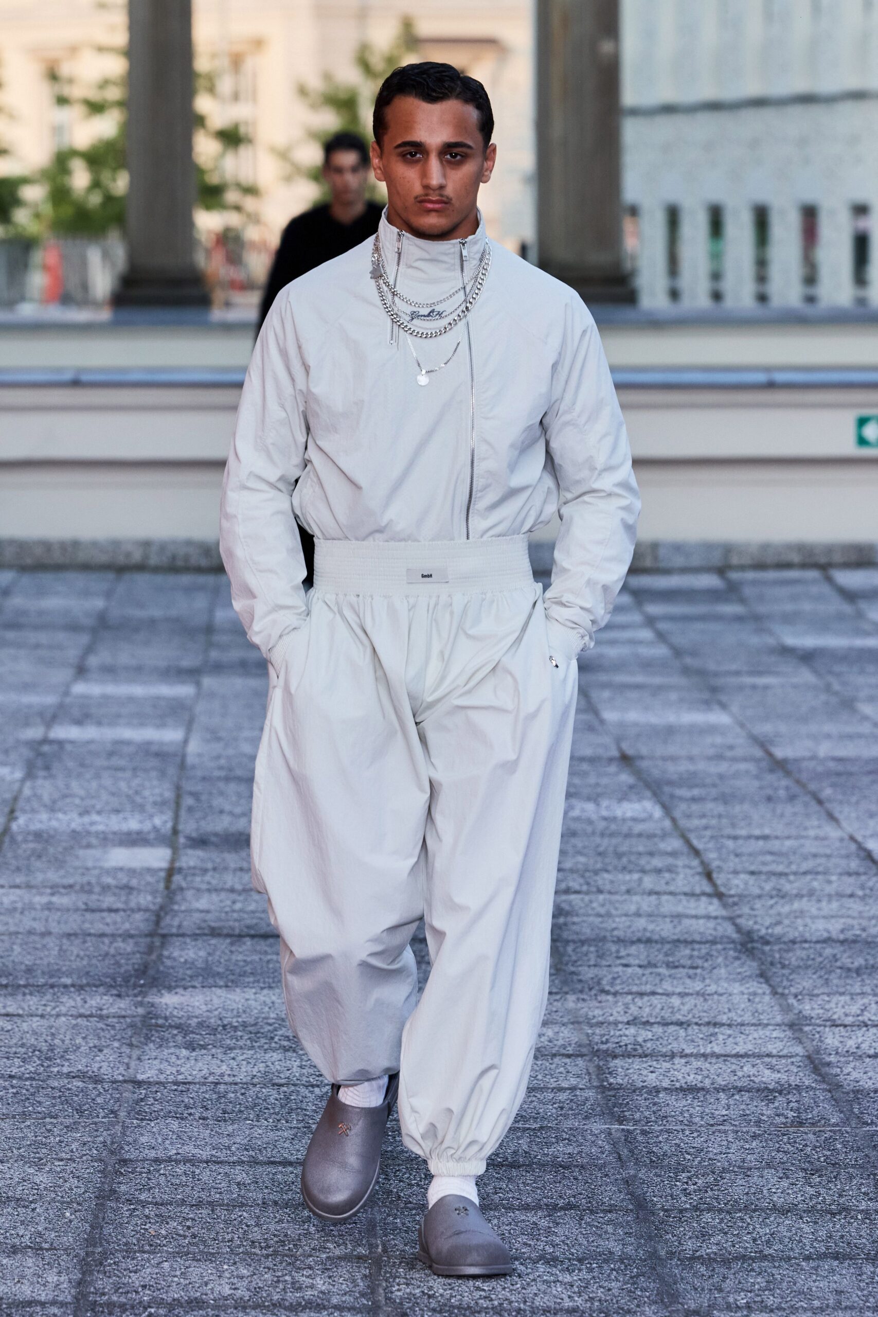 white relaxed jumpsuit with gray shoes