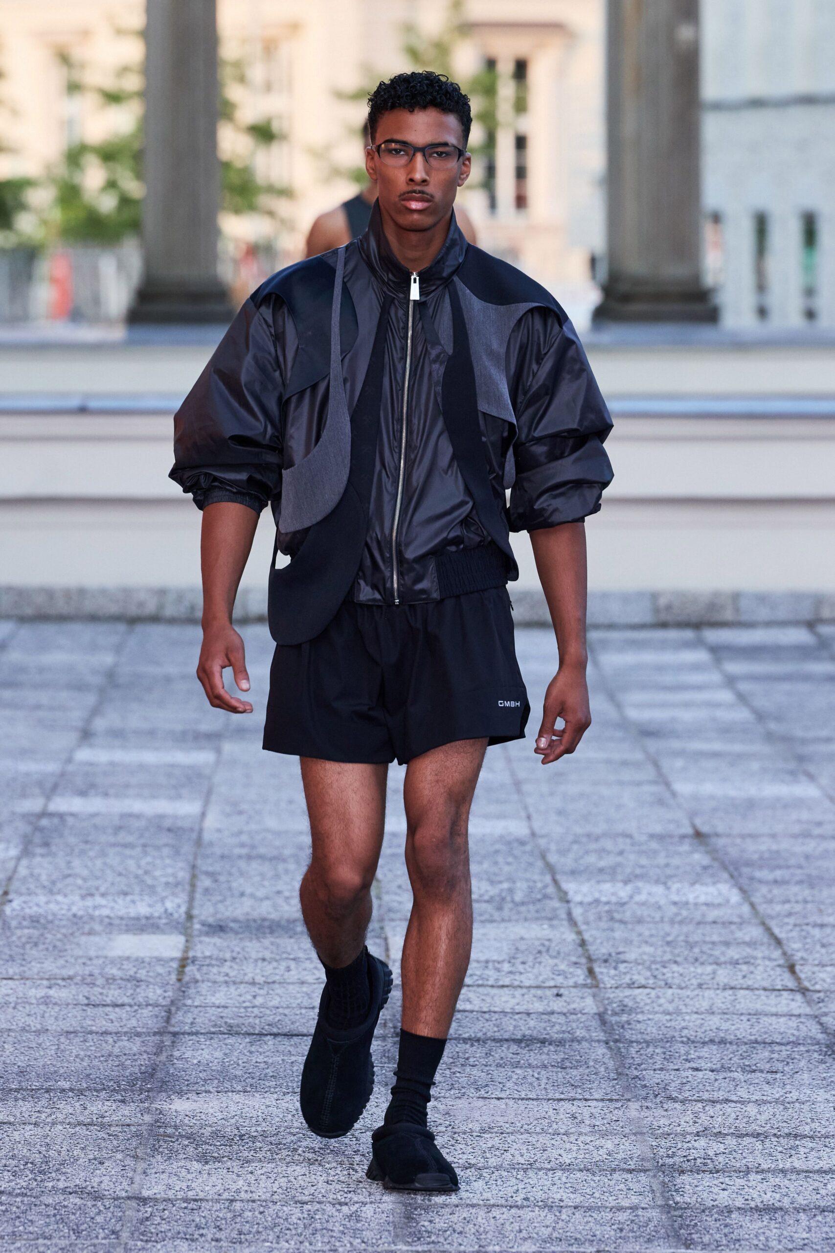 black cotton long-sleeve collared relaxed zippered layered jacket