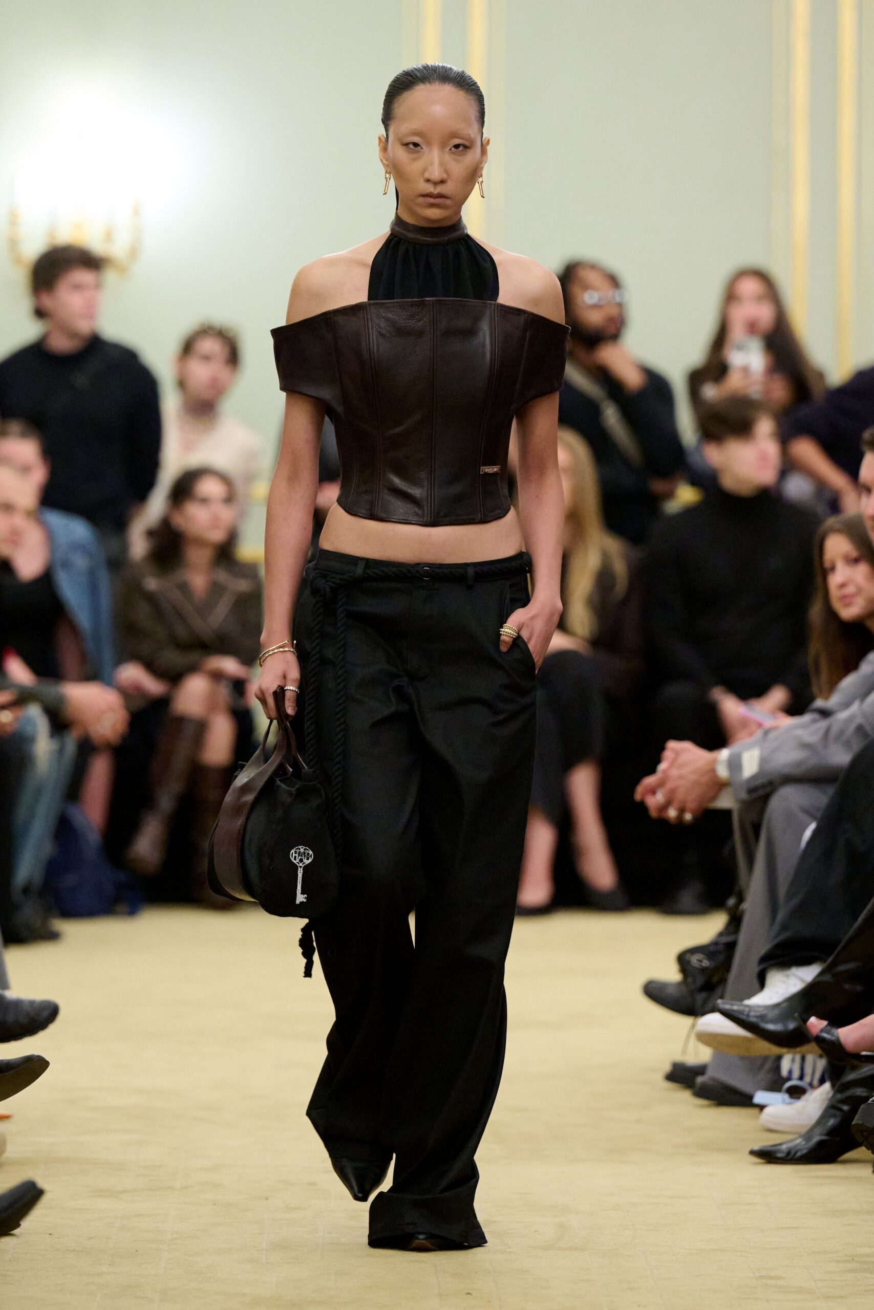 black leather fitted top and relaxed pants