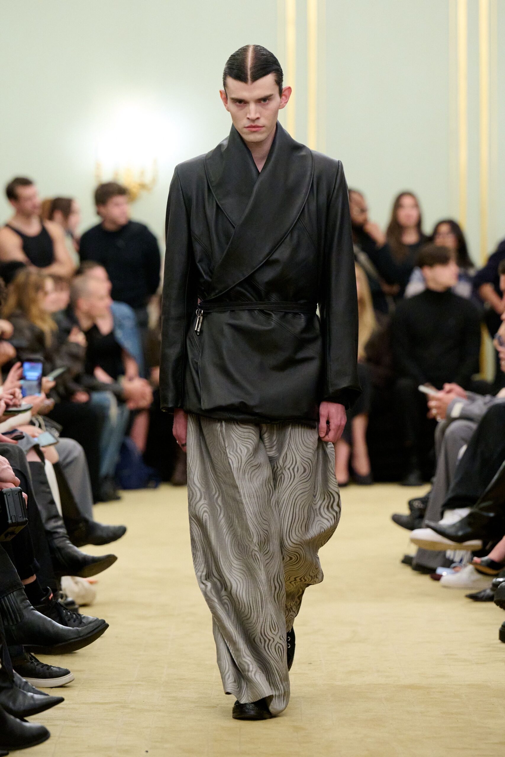 black leather fitted jacket with gray wide-leg pants