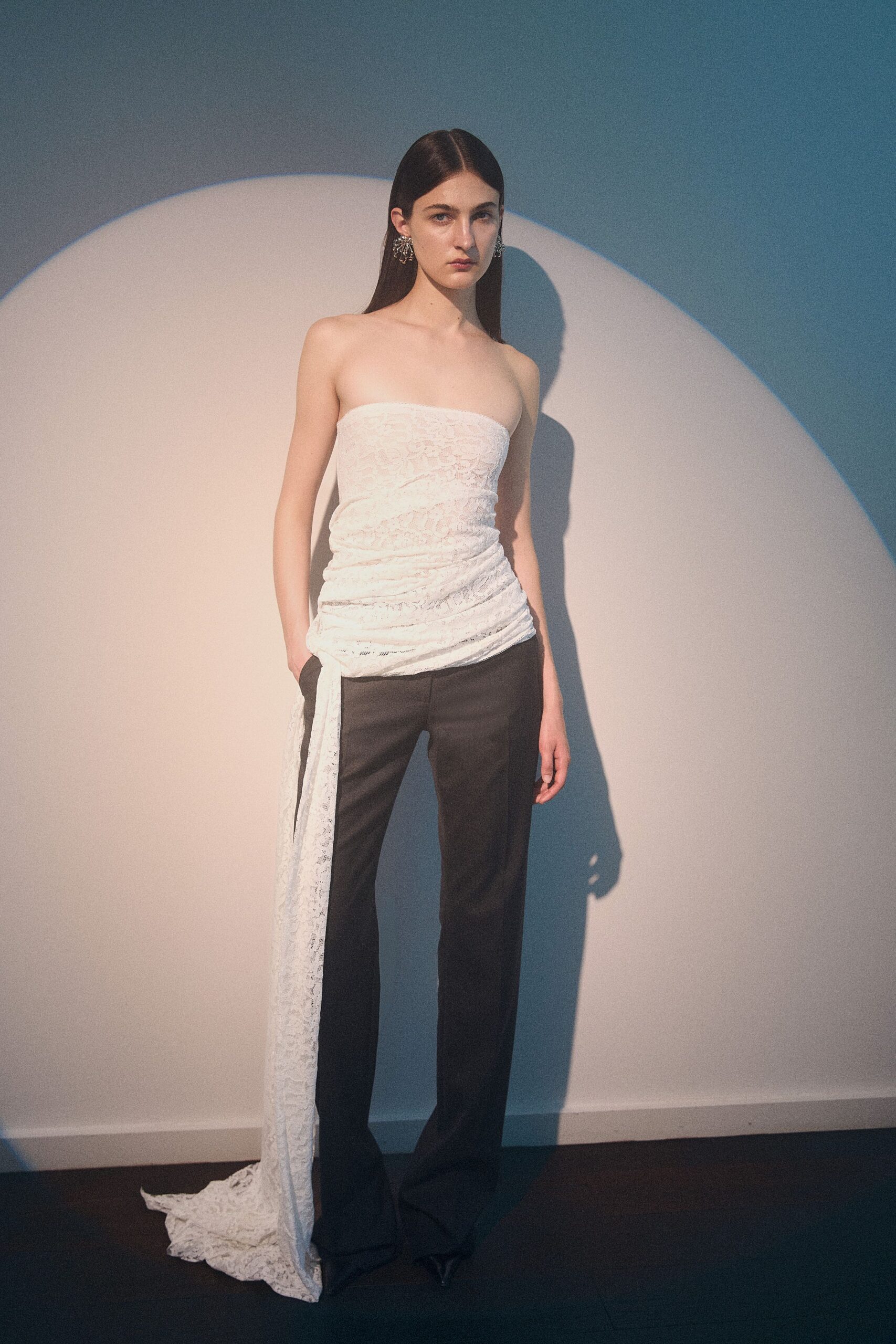 white lace strapless top with black pants
