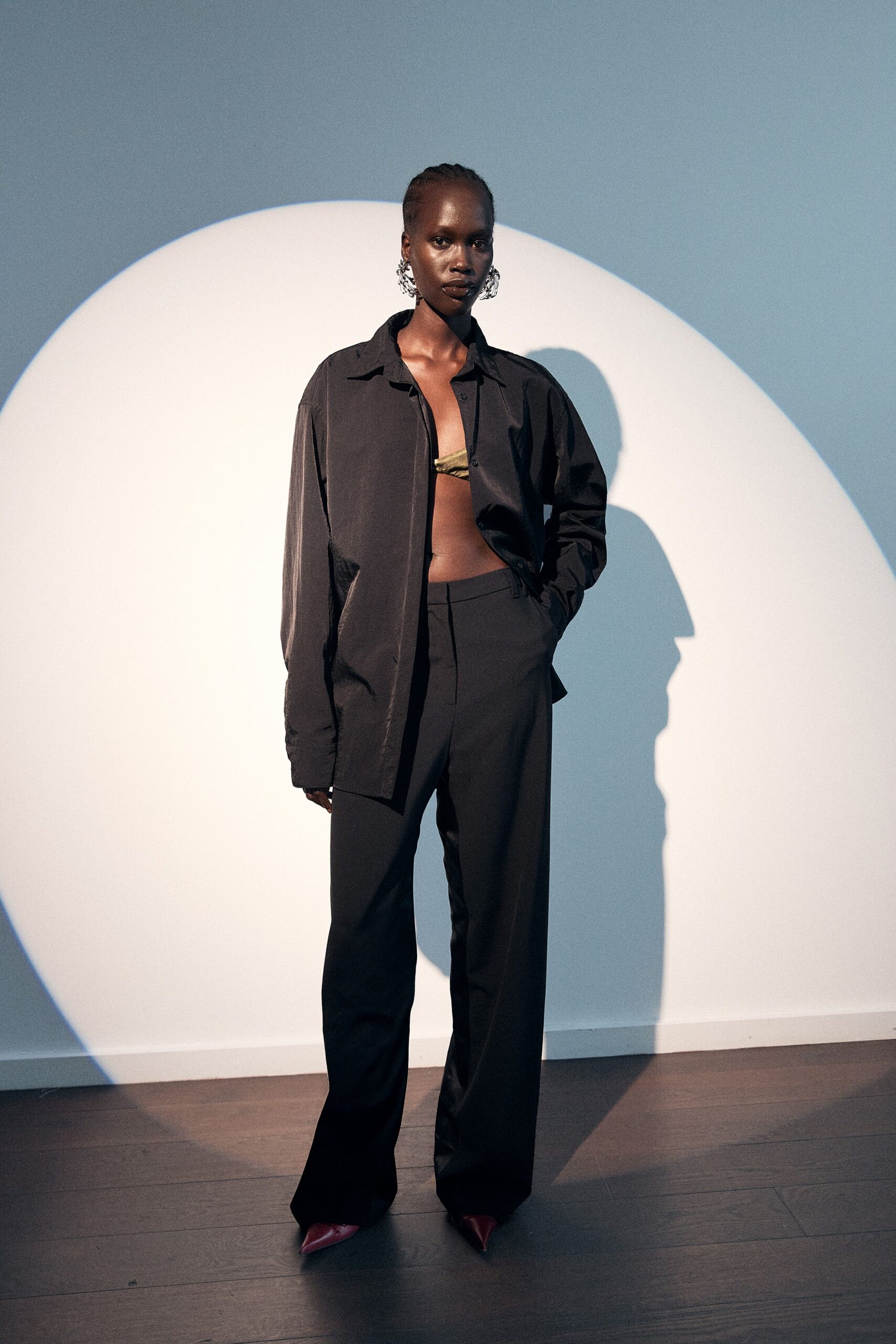 black oversized shirt with relaxed pants