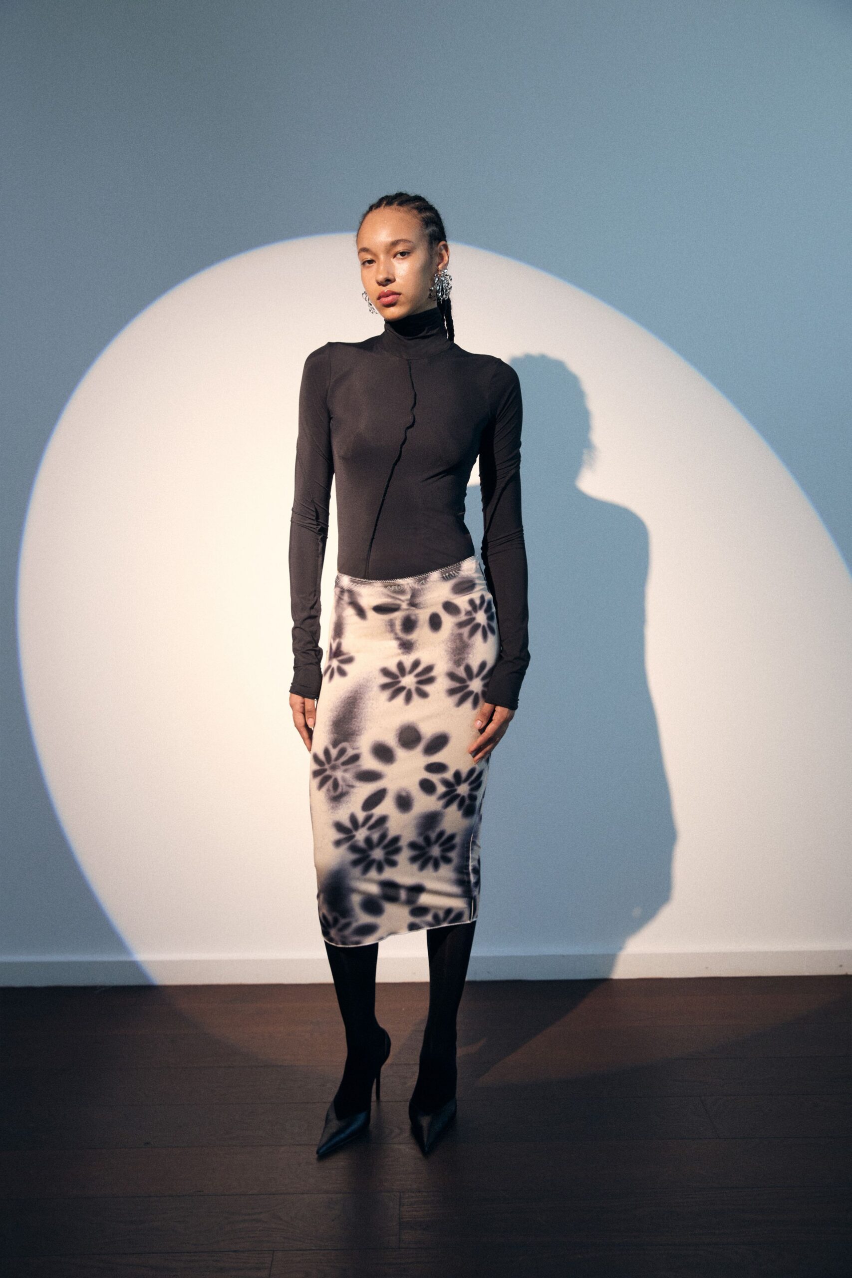 black fitted top with printed skirt
