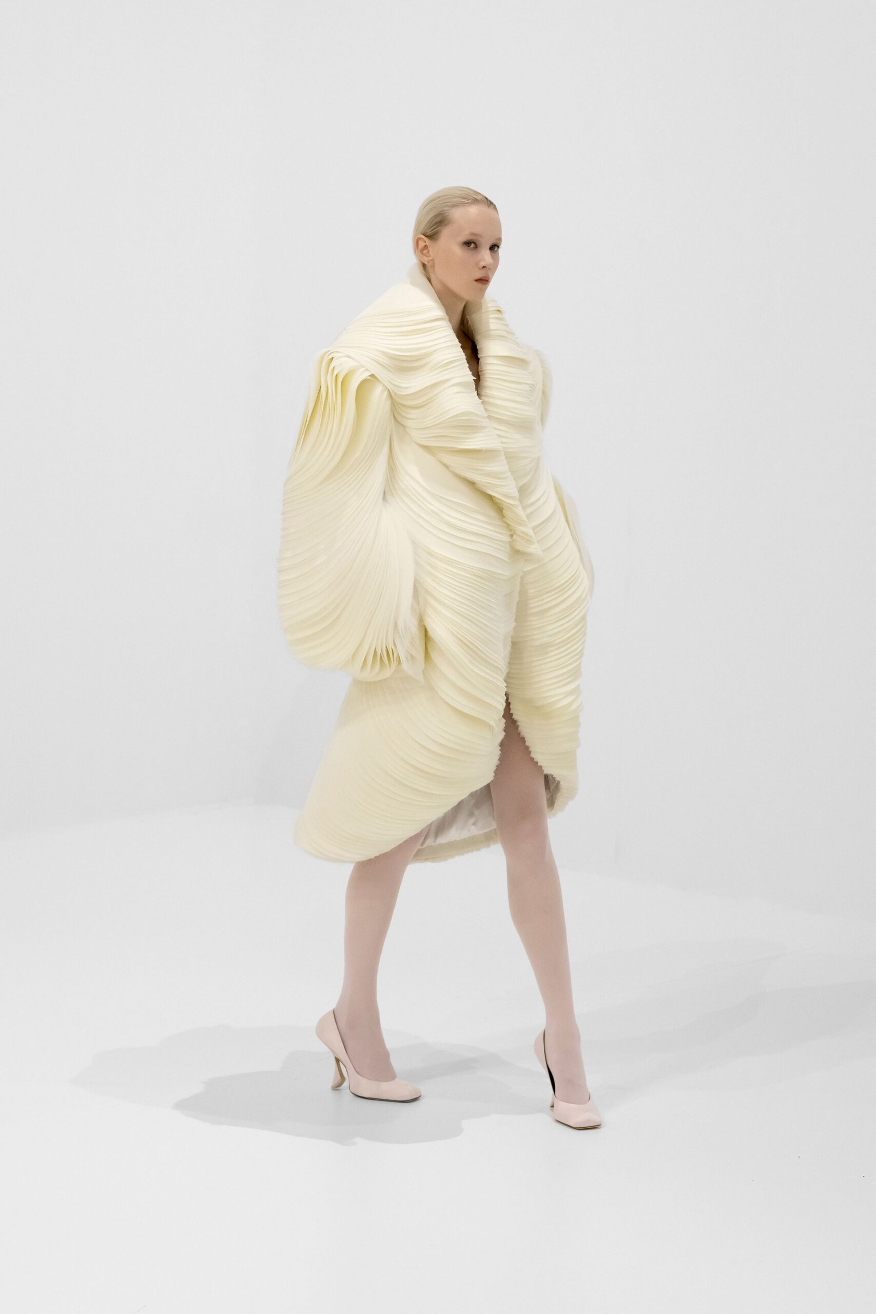 white pleated coat with heels