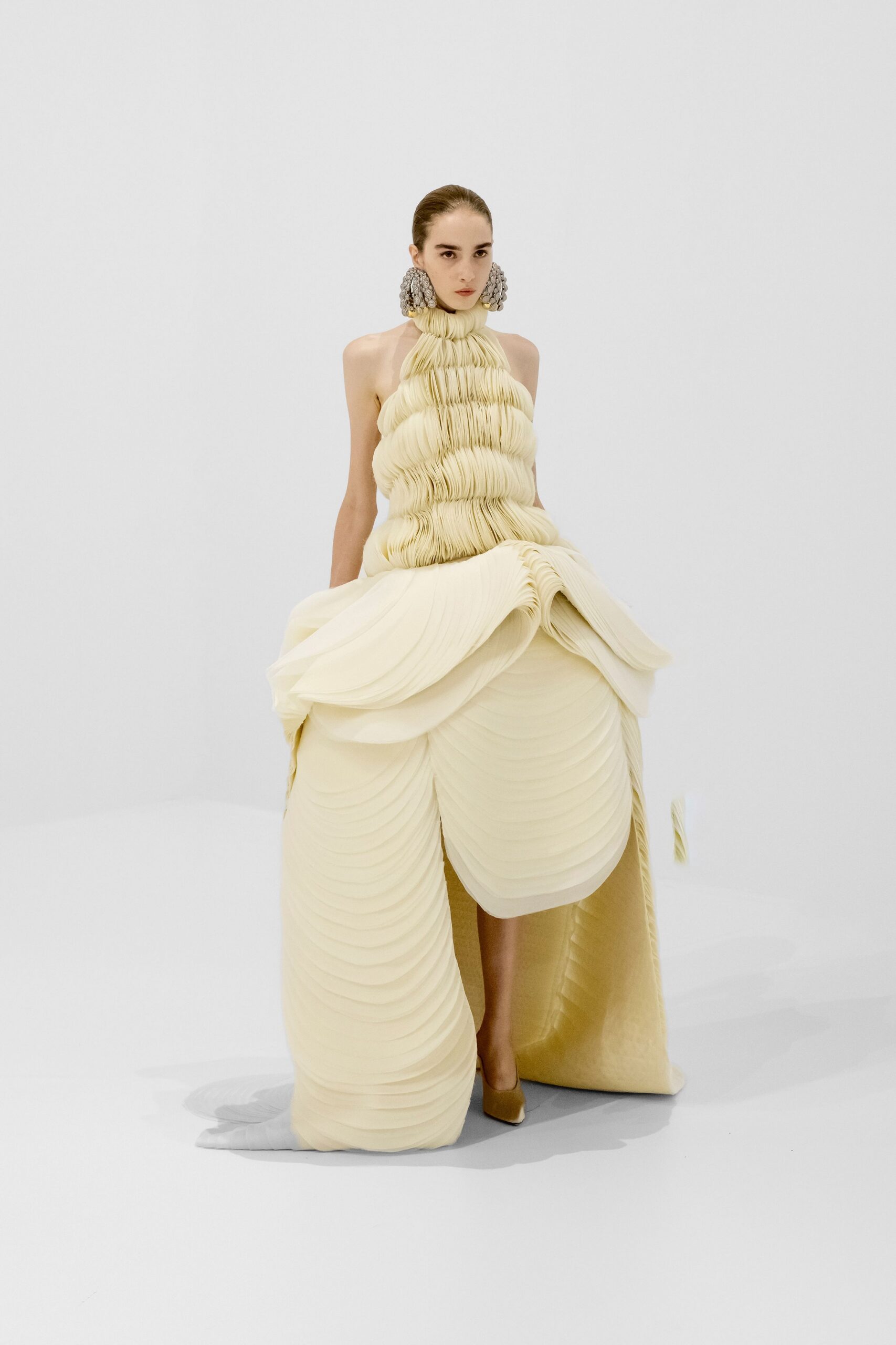 ivory silk sleeveless high-neck fitted pleated draped gown