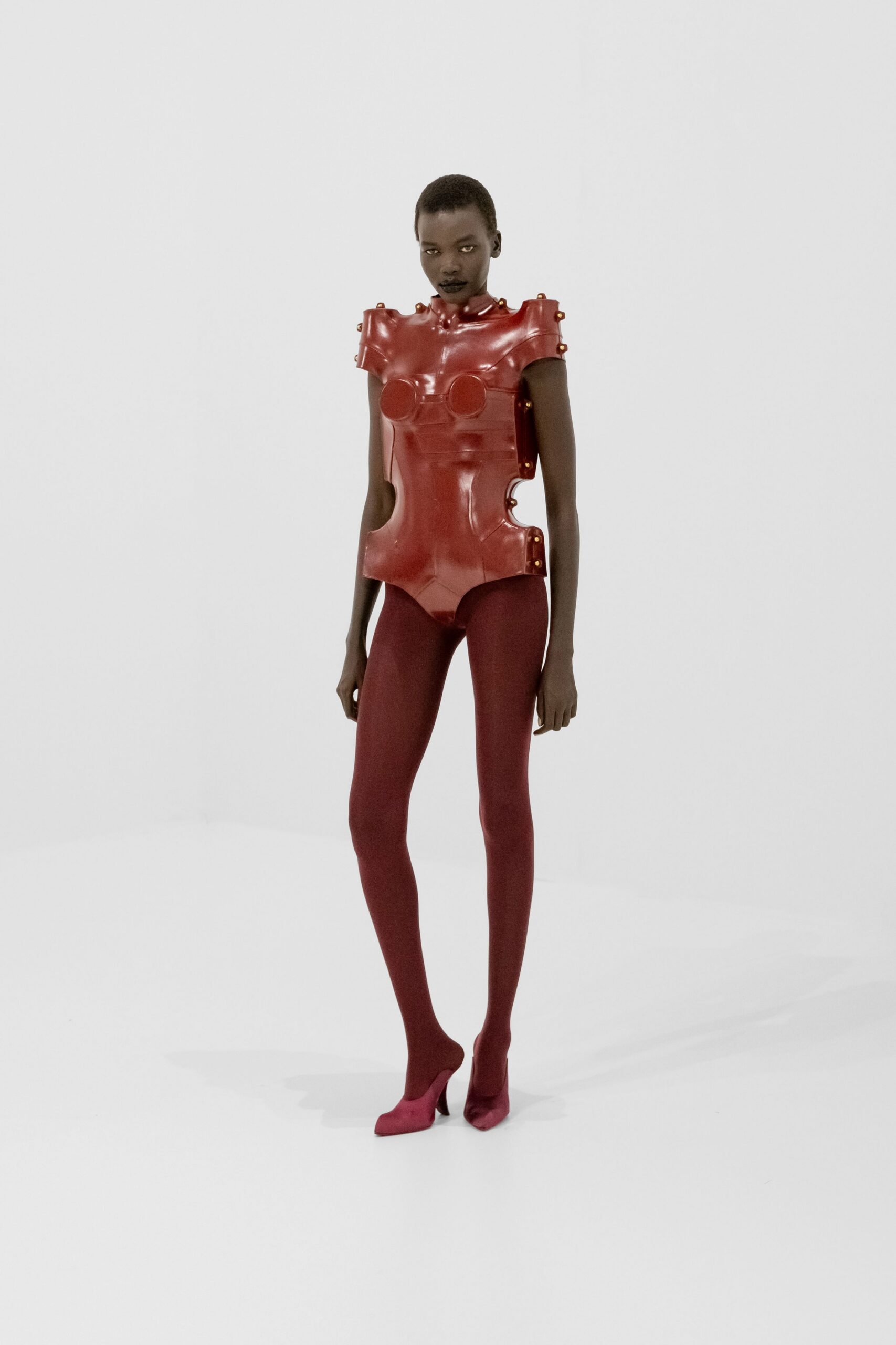 red vinyl sleeveless high-neck fitted embellished bodysuit