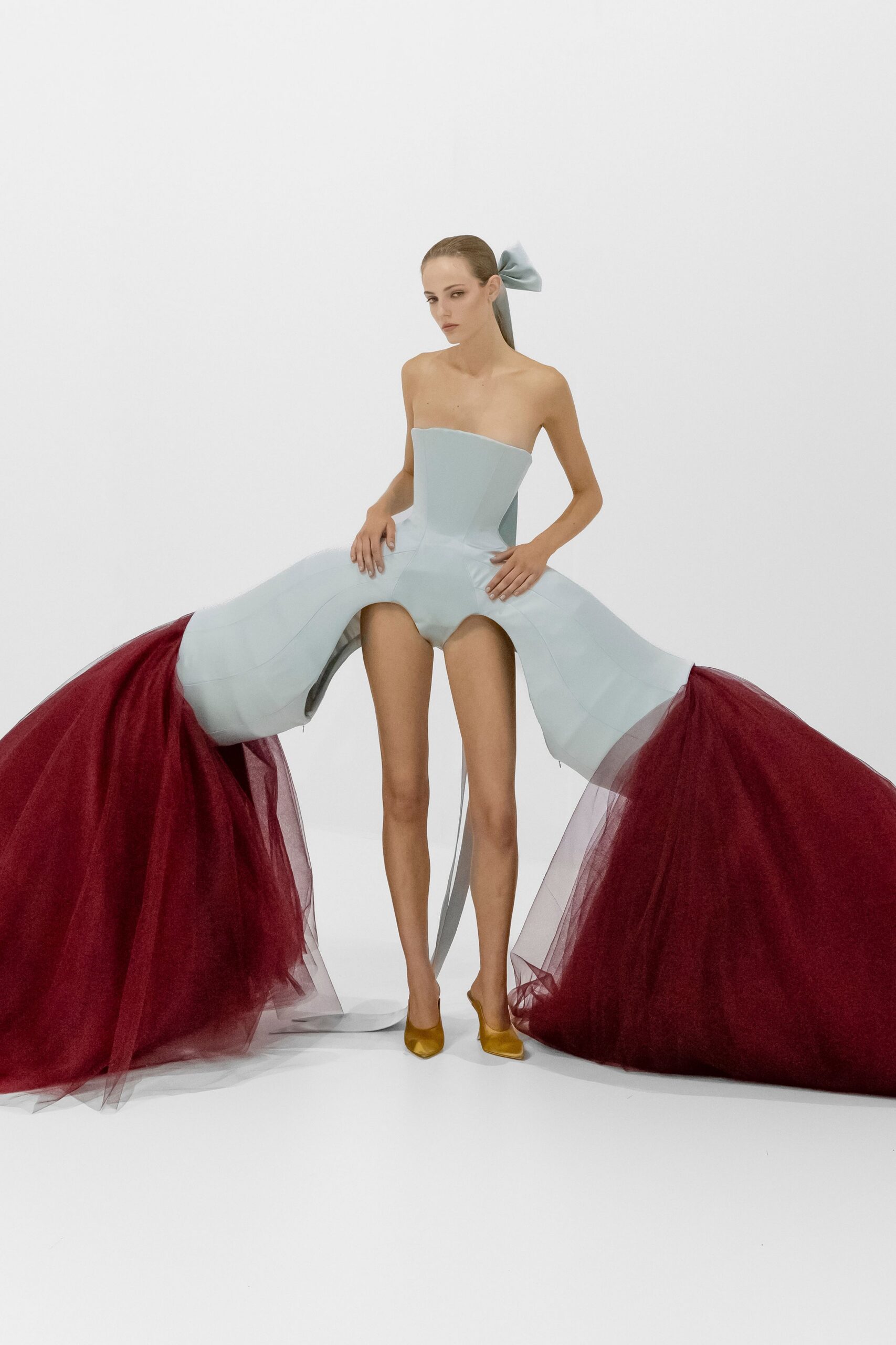 blue tulle strapless fitted layered flared flowing gown