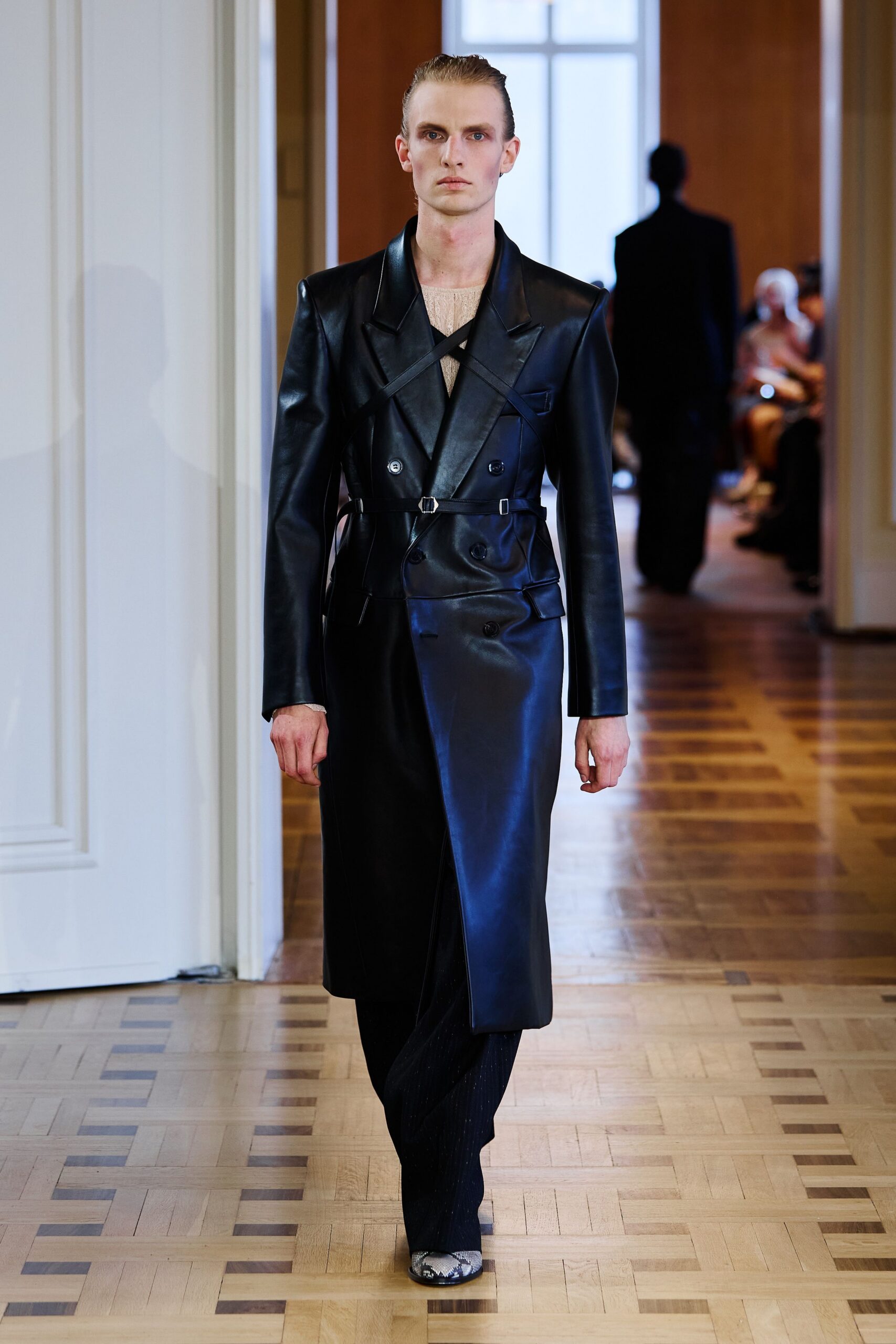 black leather long-sleeve collared fitted zippered belted coat