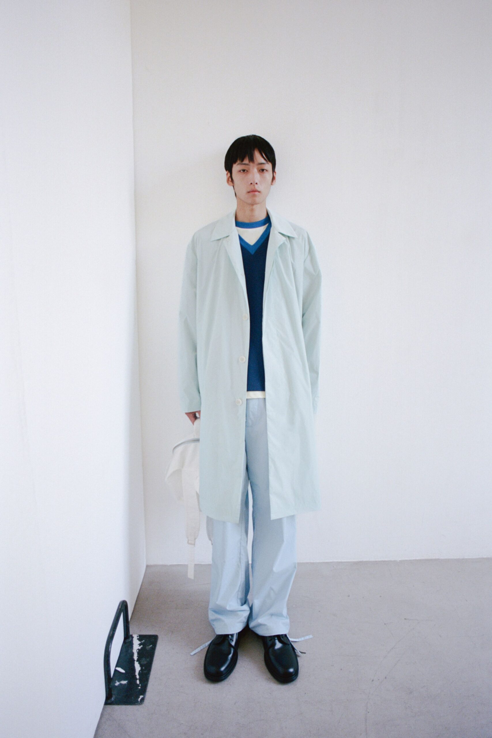 blue cotton long-sleeve collared relaxed buttoned coat
