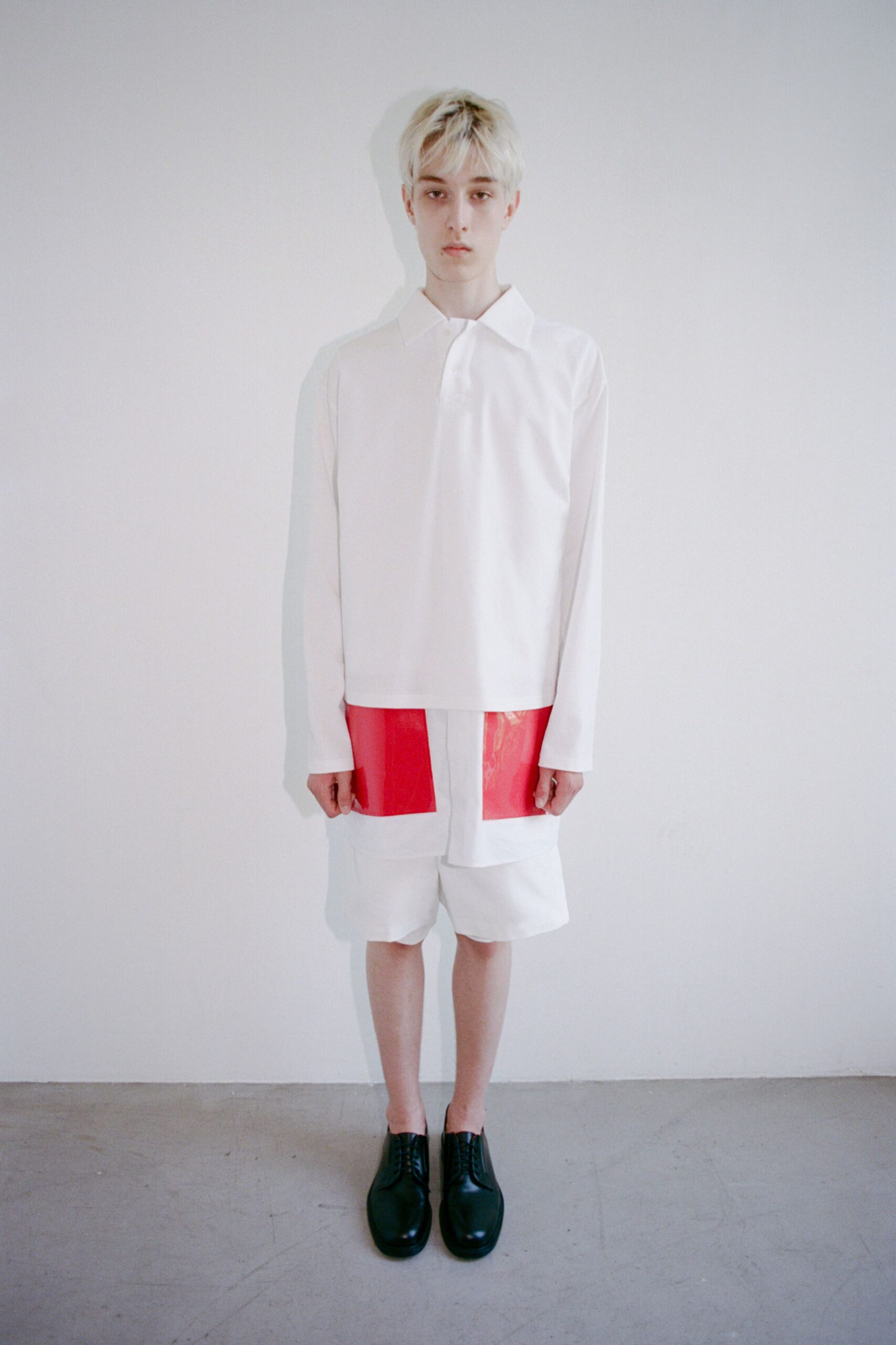 white shirt red vinyl shorts