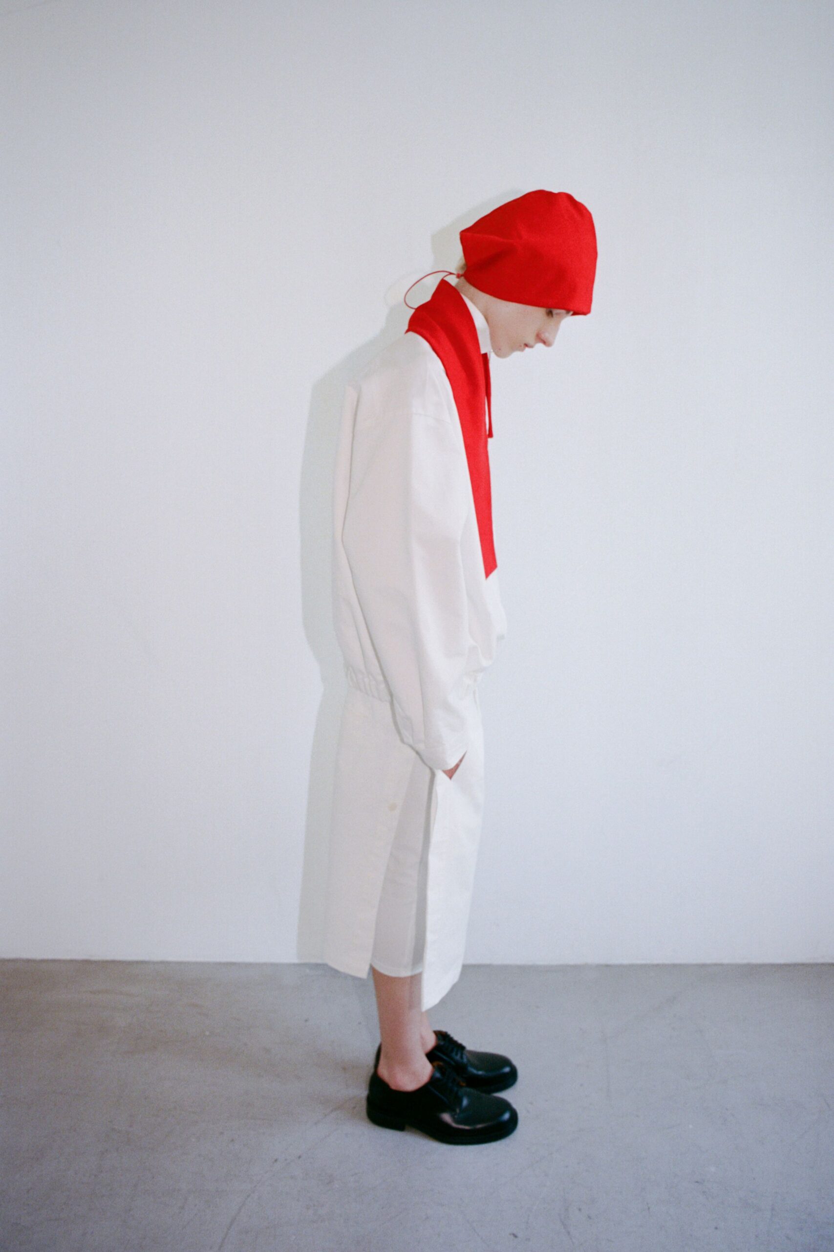 white relaxed dress with red accessories