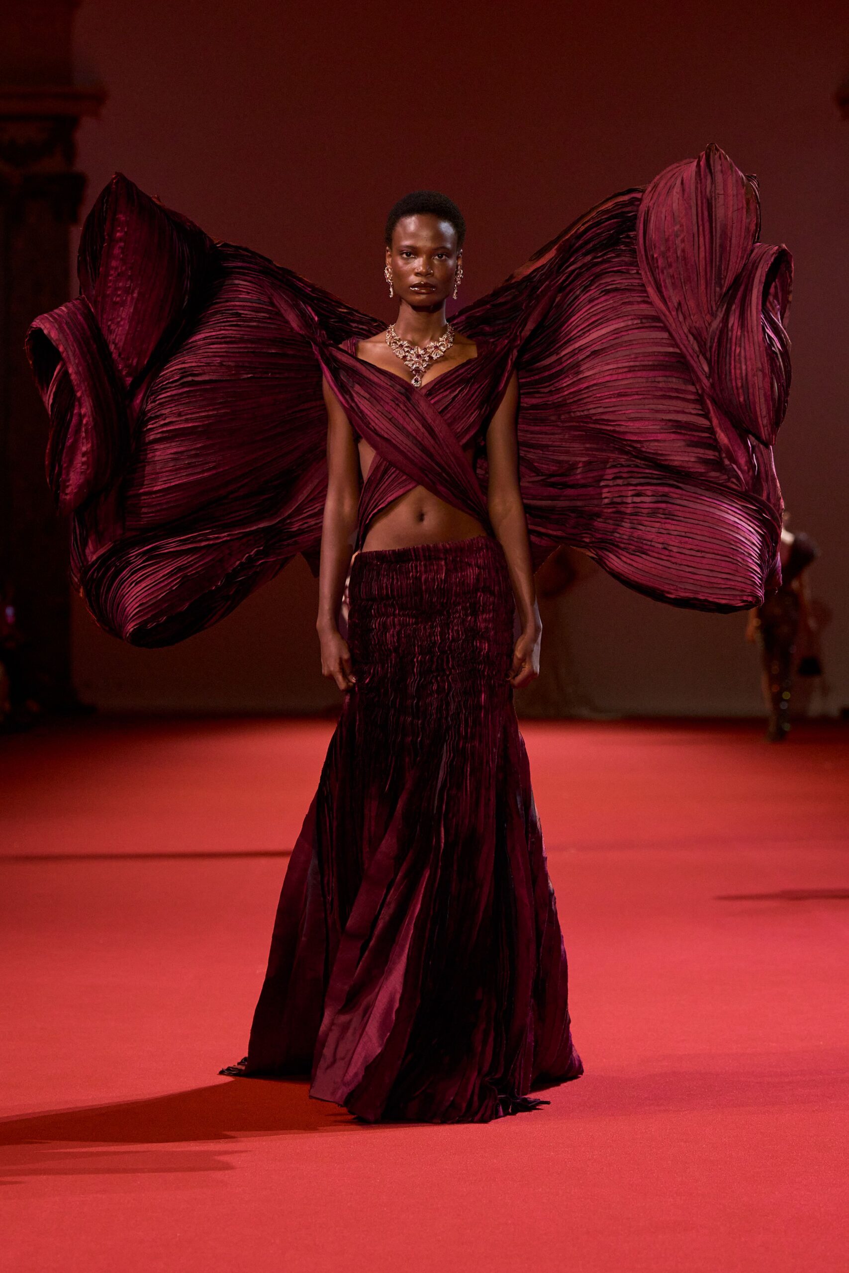 red pleated silk gown