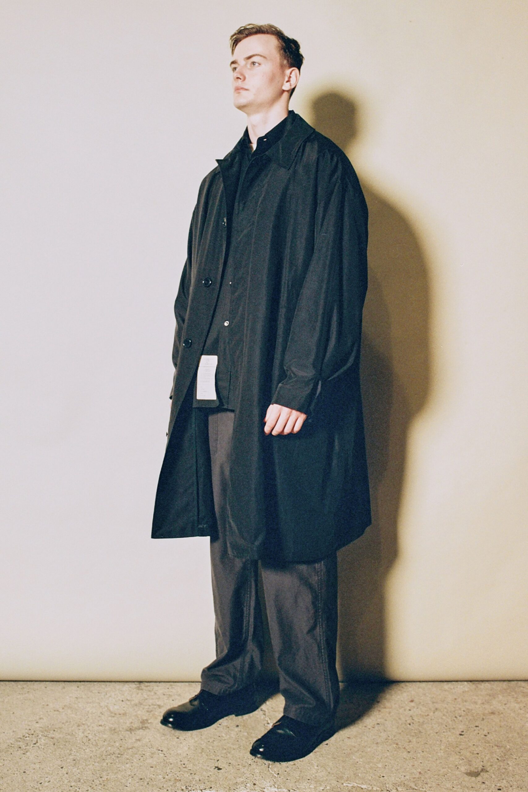 black cotton long-sleeve collared relaxed coat