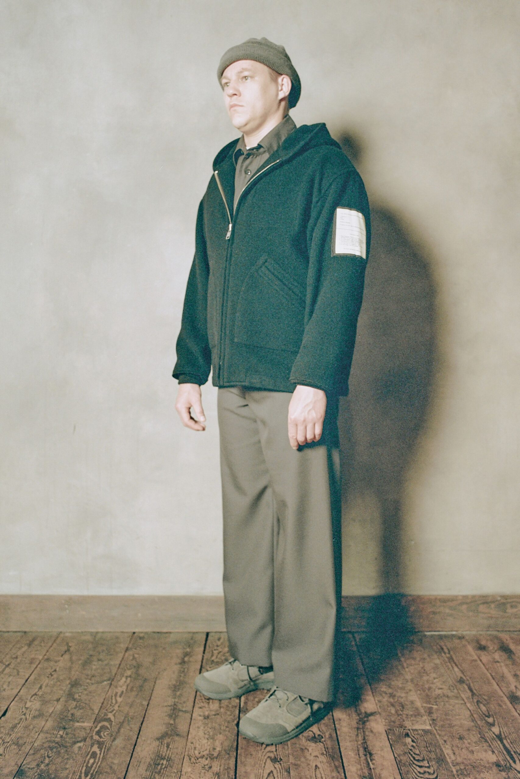 black hoodie gray pants green shoes