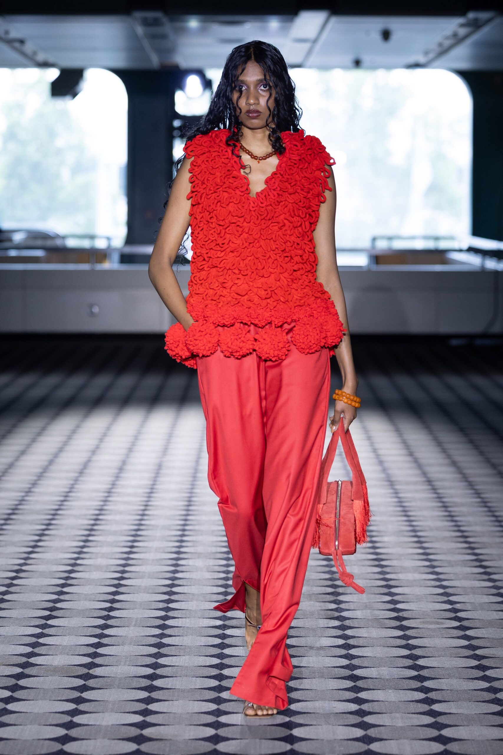 red ruffled top with relaxed pants