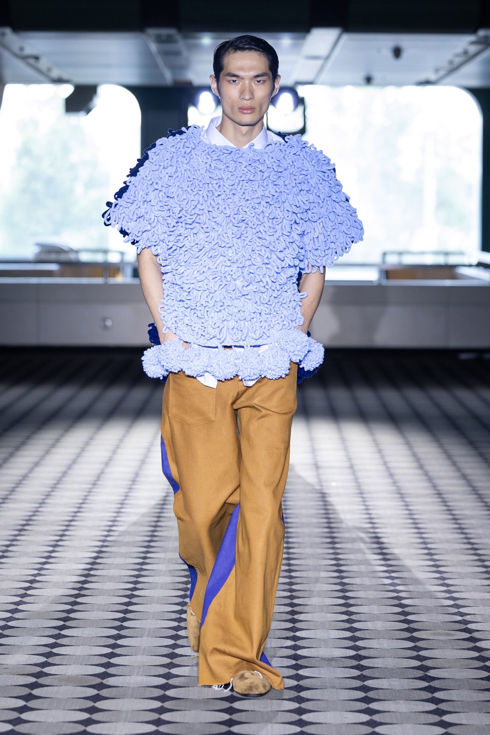 blue layered top with brown pants