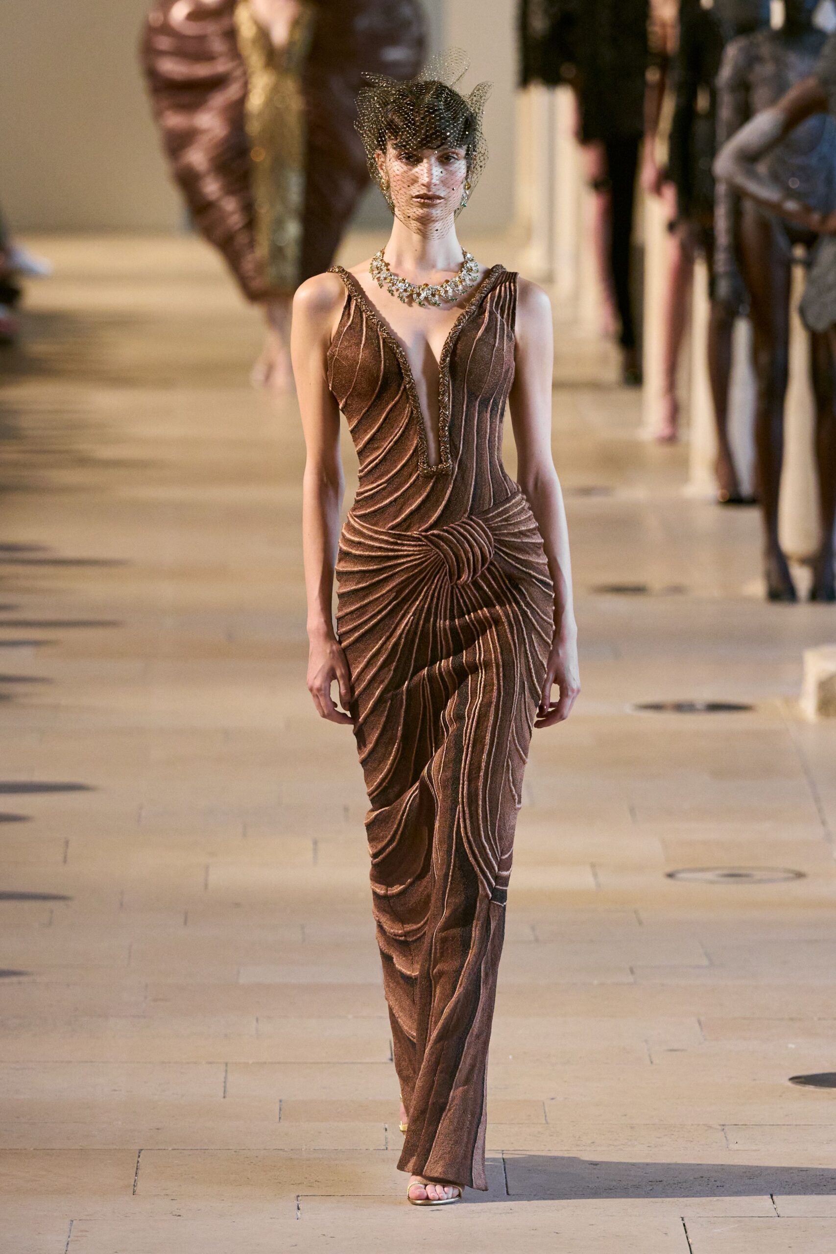 brown pleated sleeveless gown