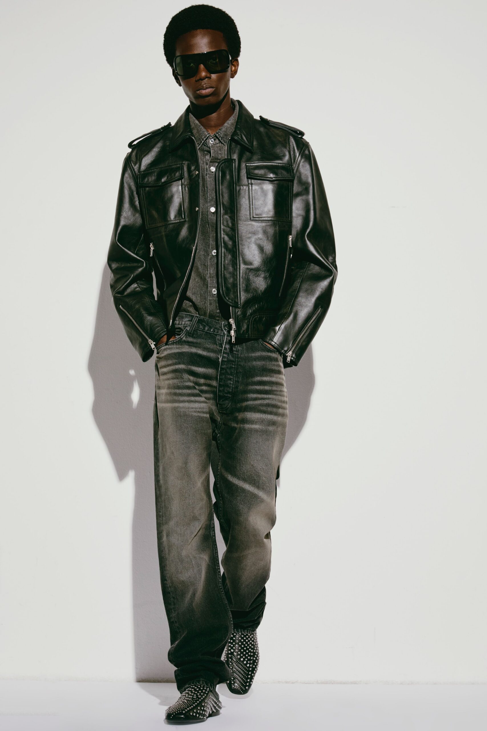 black leather jacket with gray shirt