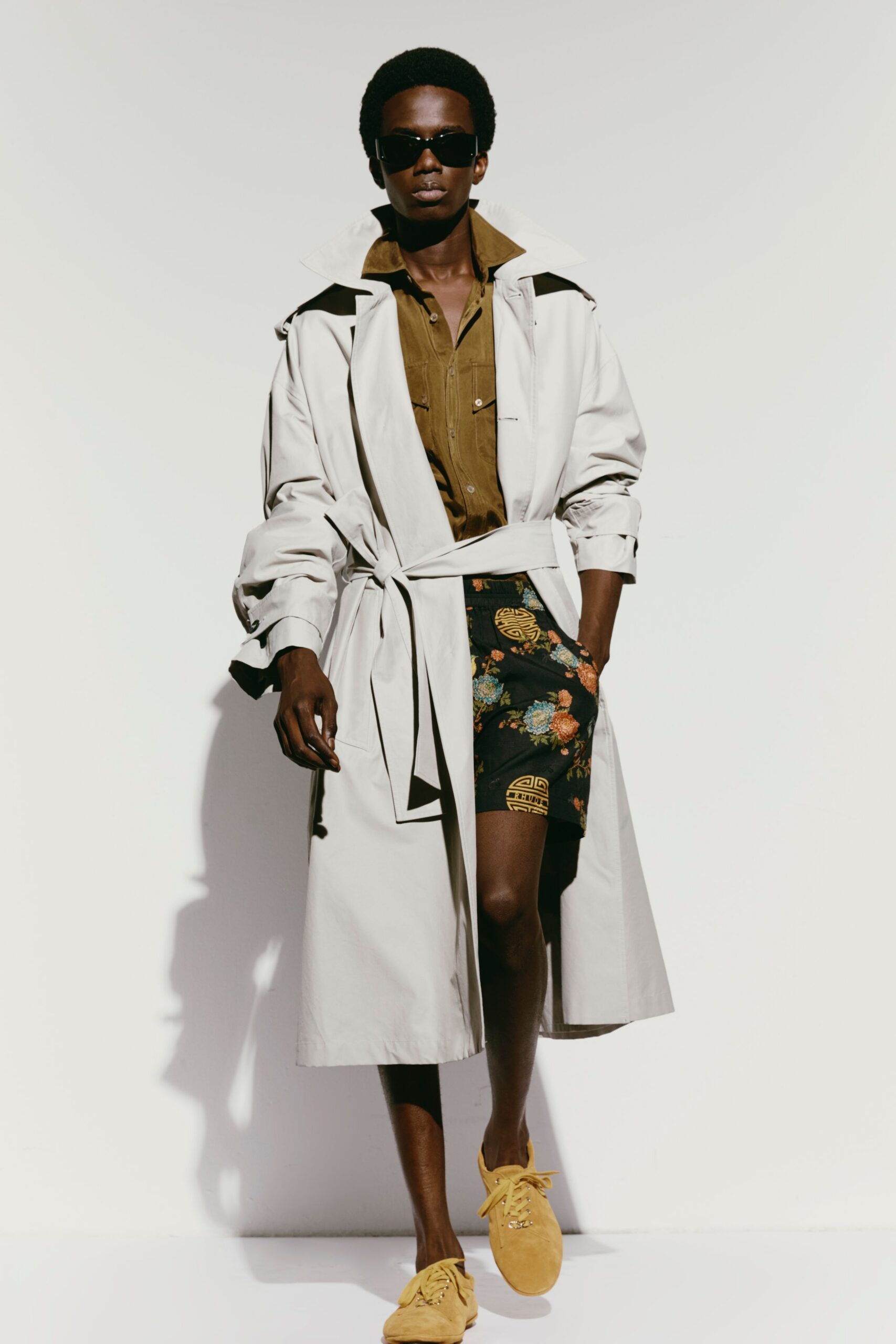 beige trench coat with printed shorts