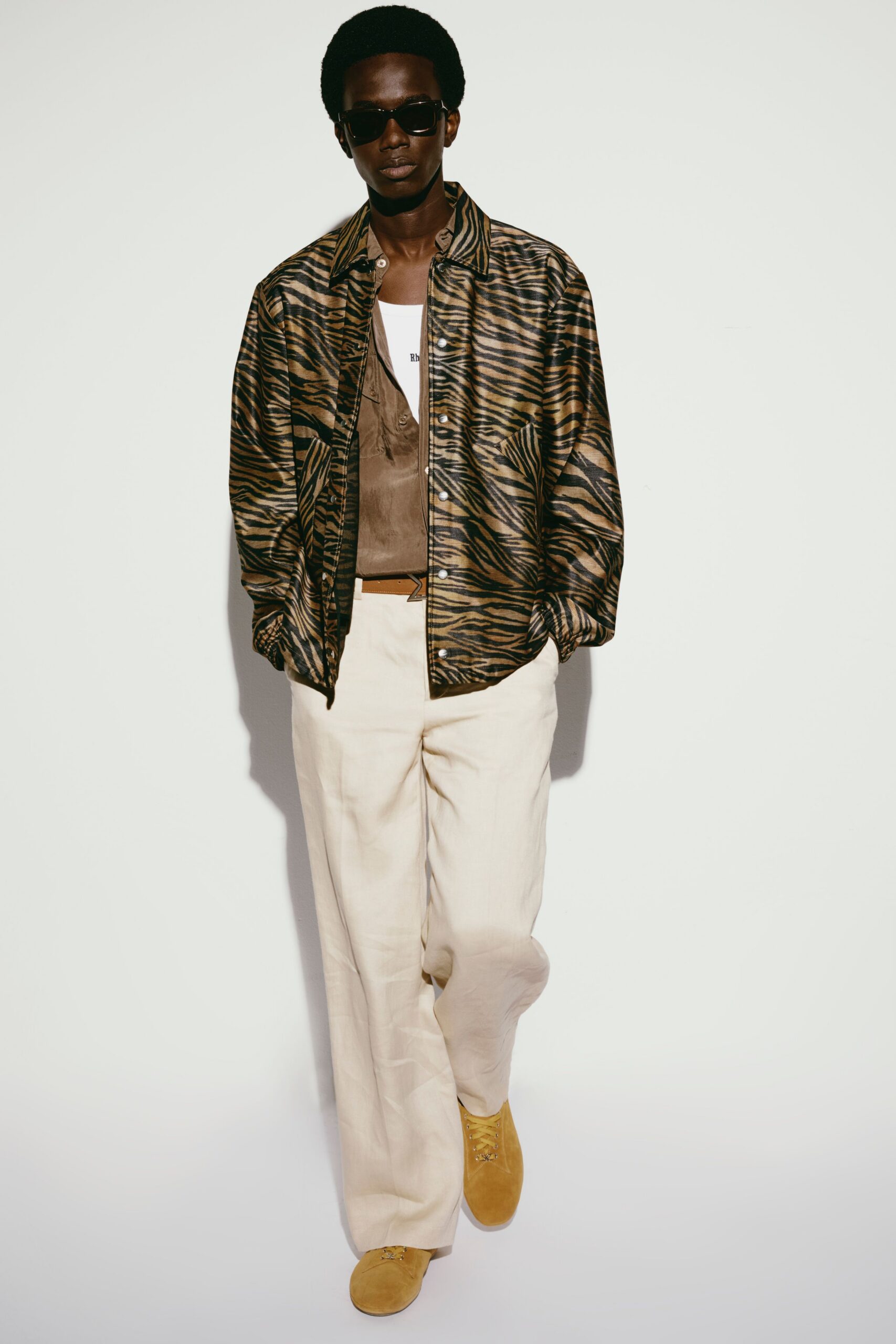 brown printed jacket with beige pants