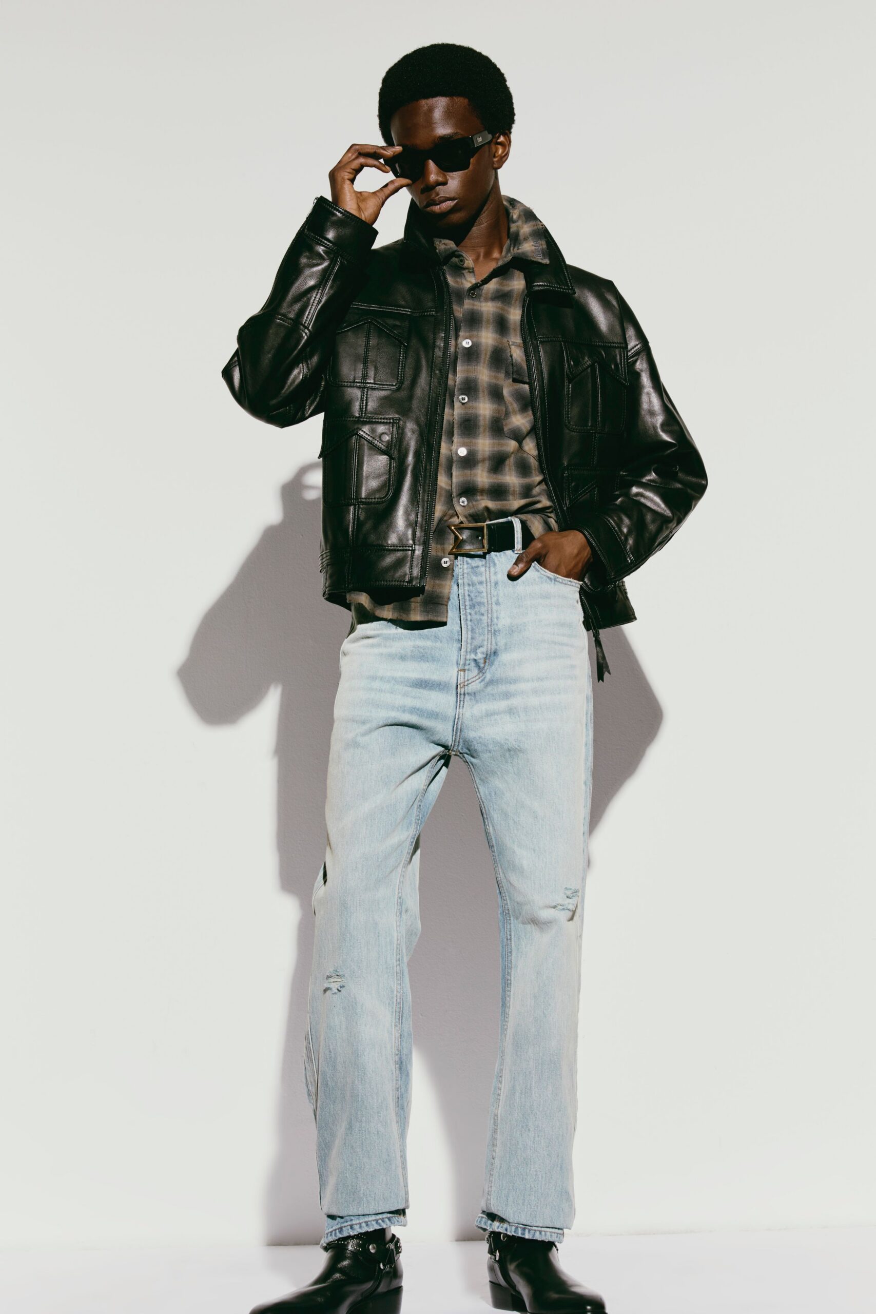 black leather jacket with checked shirt