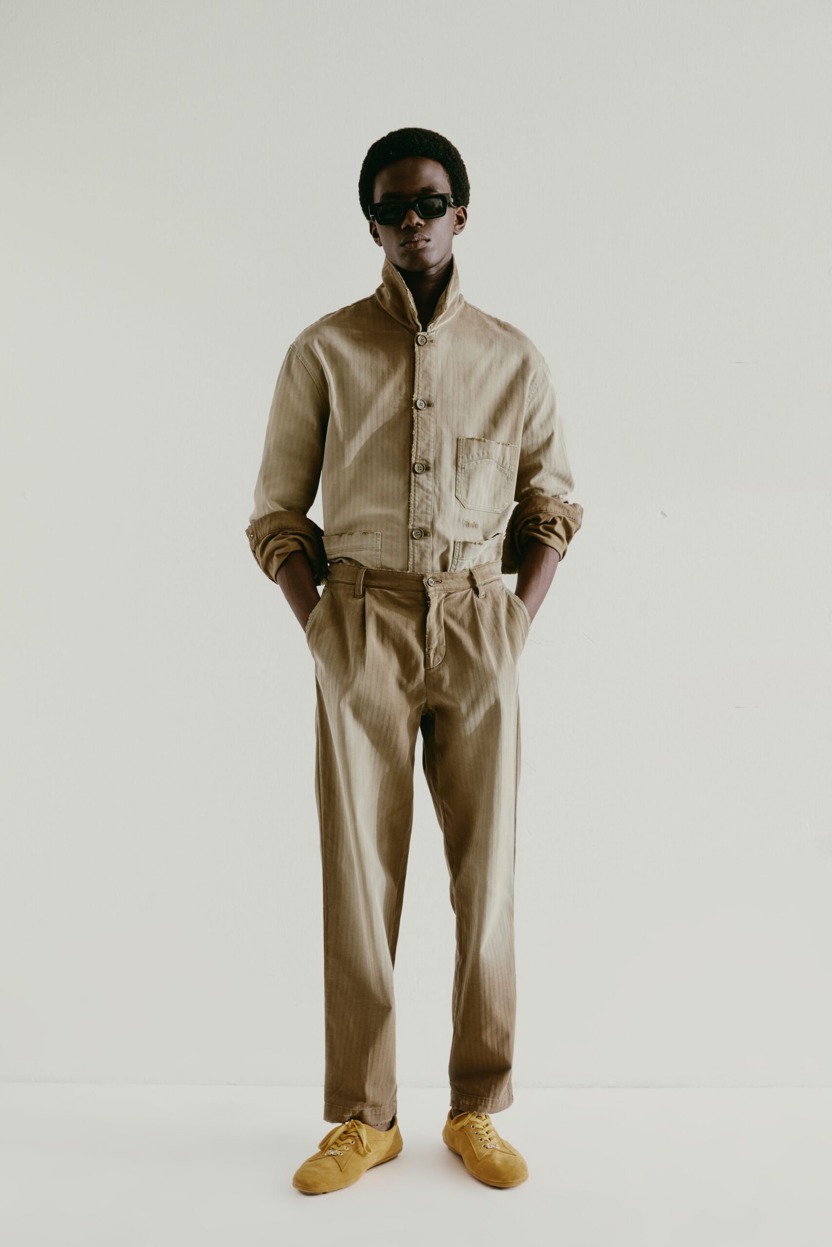 beige cotton relaxed pleated pants