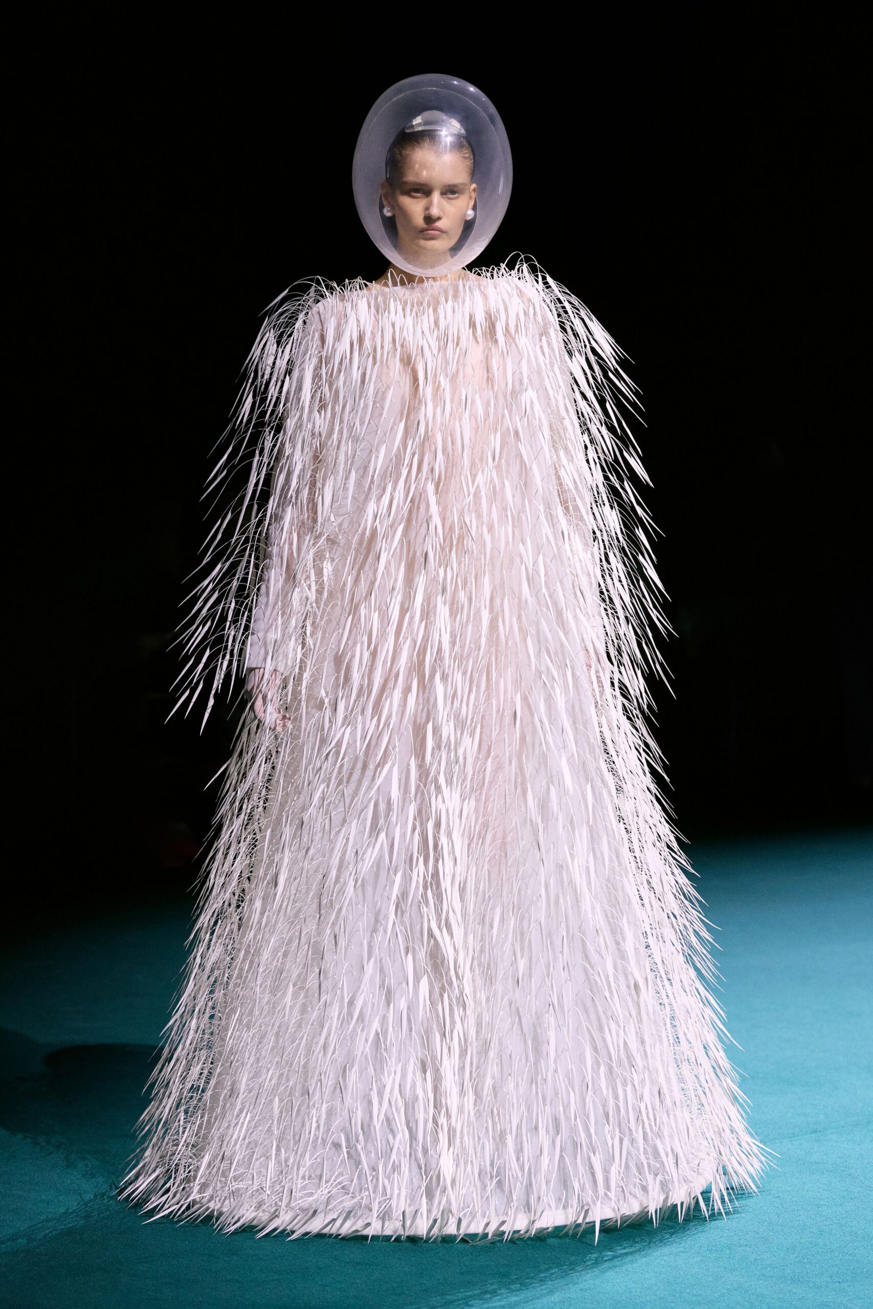 white fringed gown with clear hat
