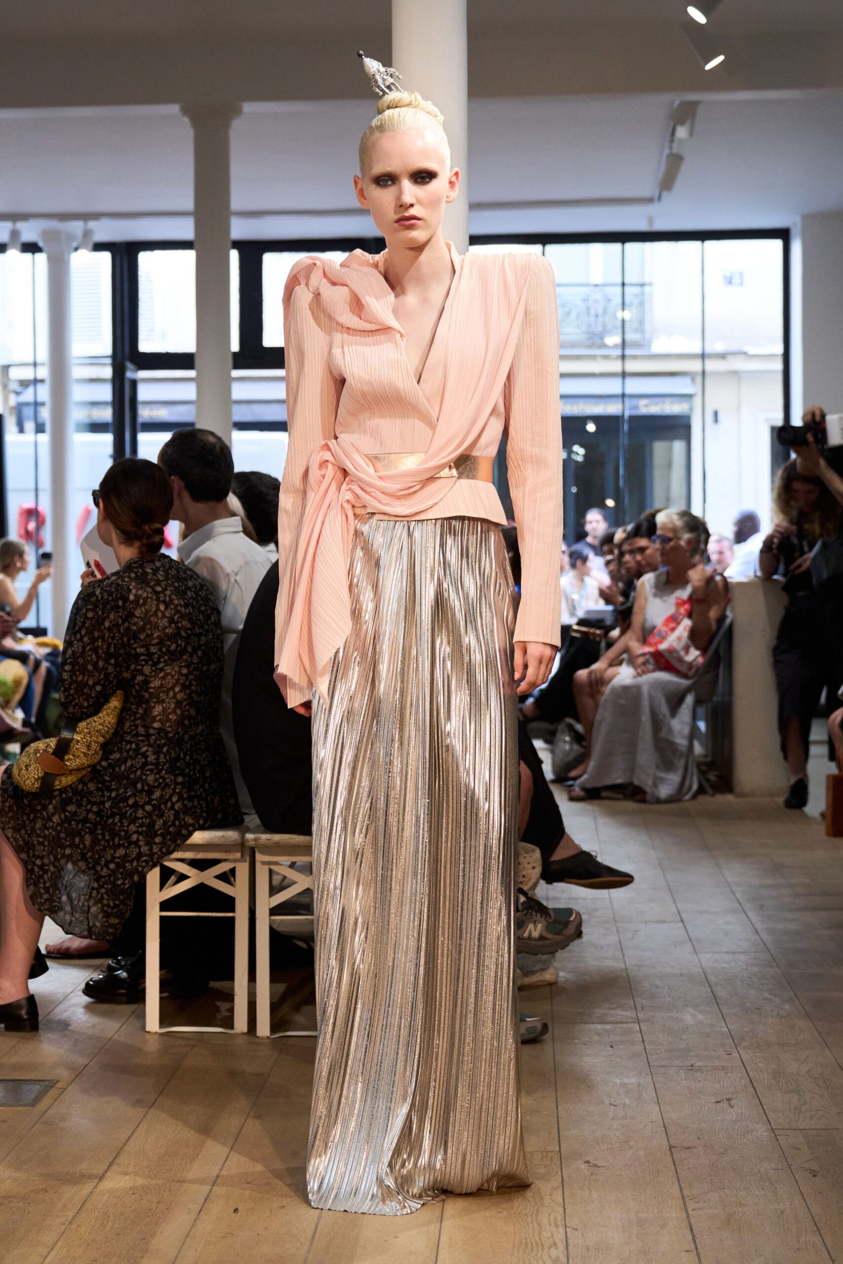 pink silk blouse and silver pleated skirt