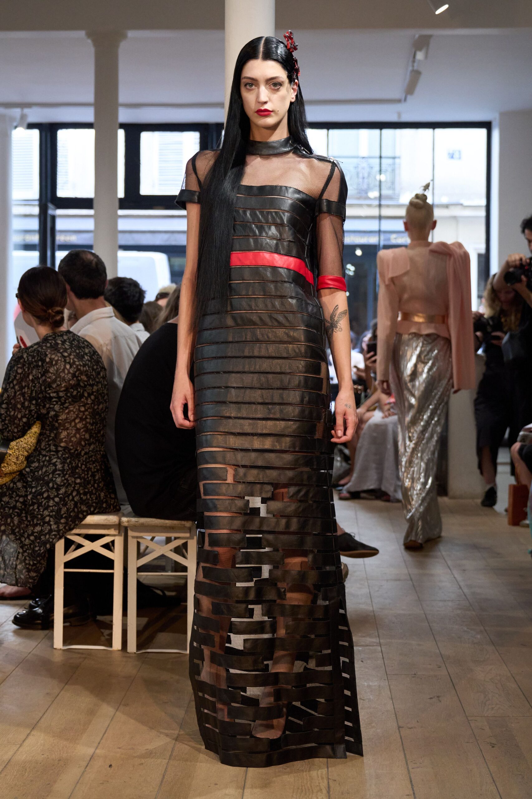 black mesh gown with red belt